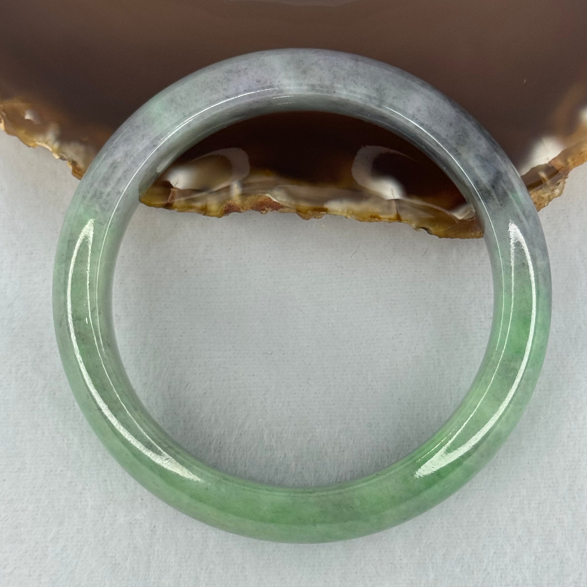Type A Translucent Light Green with Patches of Faint Grey and Greyish Black Jadeite Bangle Internal Diameter 57.75mm 404.45cts 81.28g 17.3 by 9.0mm With NGI Cert No 32885808 (Very Slight Internal Lines) - Huangs Jadeite and Jewelry Pte Ltd
