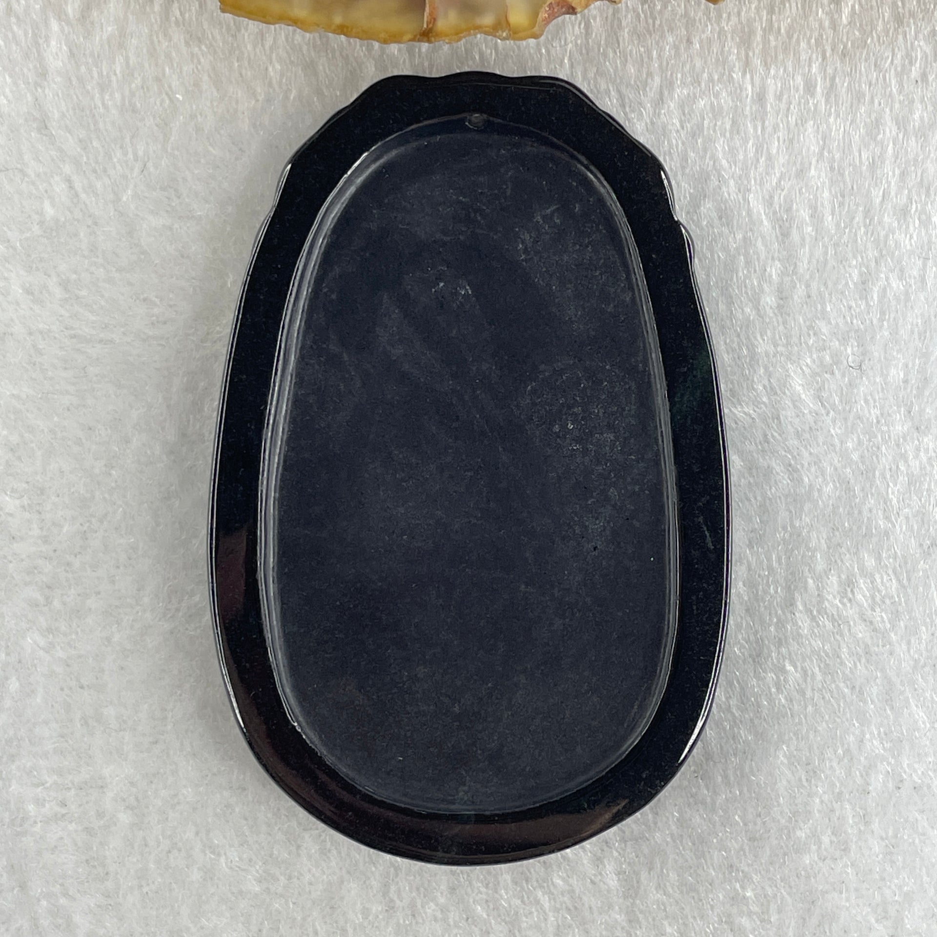 Type A Opaque to Partial Translucent Black Omphacite Jadeite Ox Pendant 20.24g 59.5 by 39.4 by 7.6mm - Huangs Jadeite and Jewelry Pte Ltd