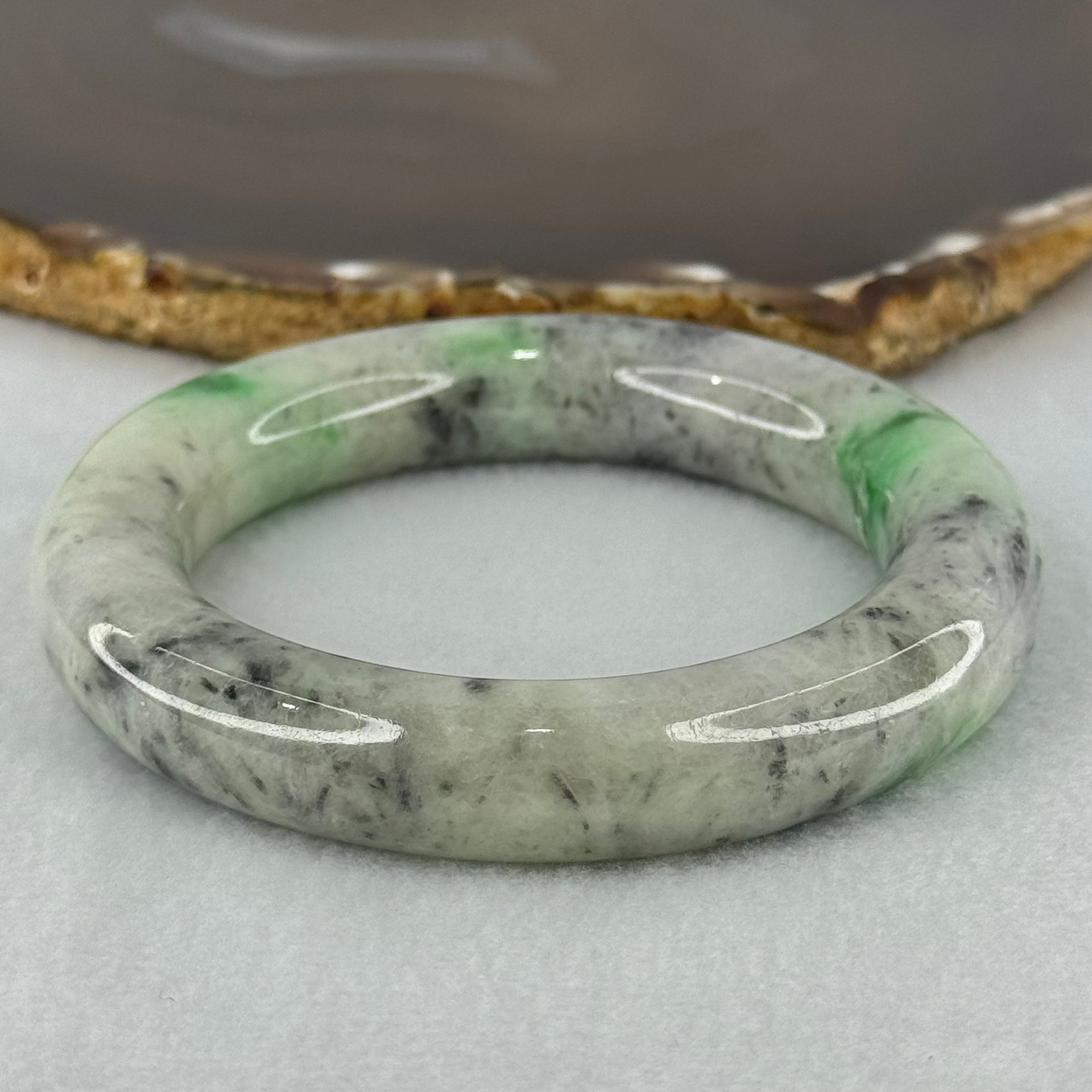 Type A Light Green with Emerald Green and Grey Patches Jadeite Bangle Internal Diameter 55.8mm 93.21g 13.4 by 13.1mm (Very Slight External Rough with Slight Internal Lines) - Huangs Jadeite and Jewelry Pte Ltd