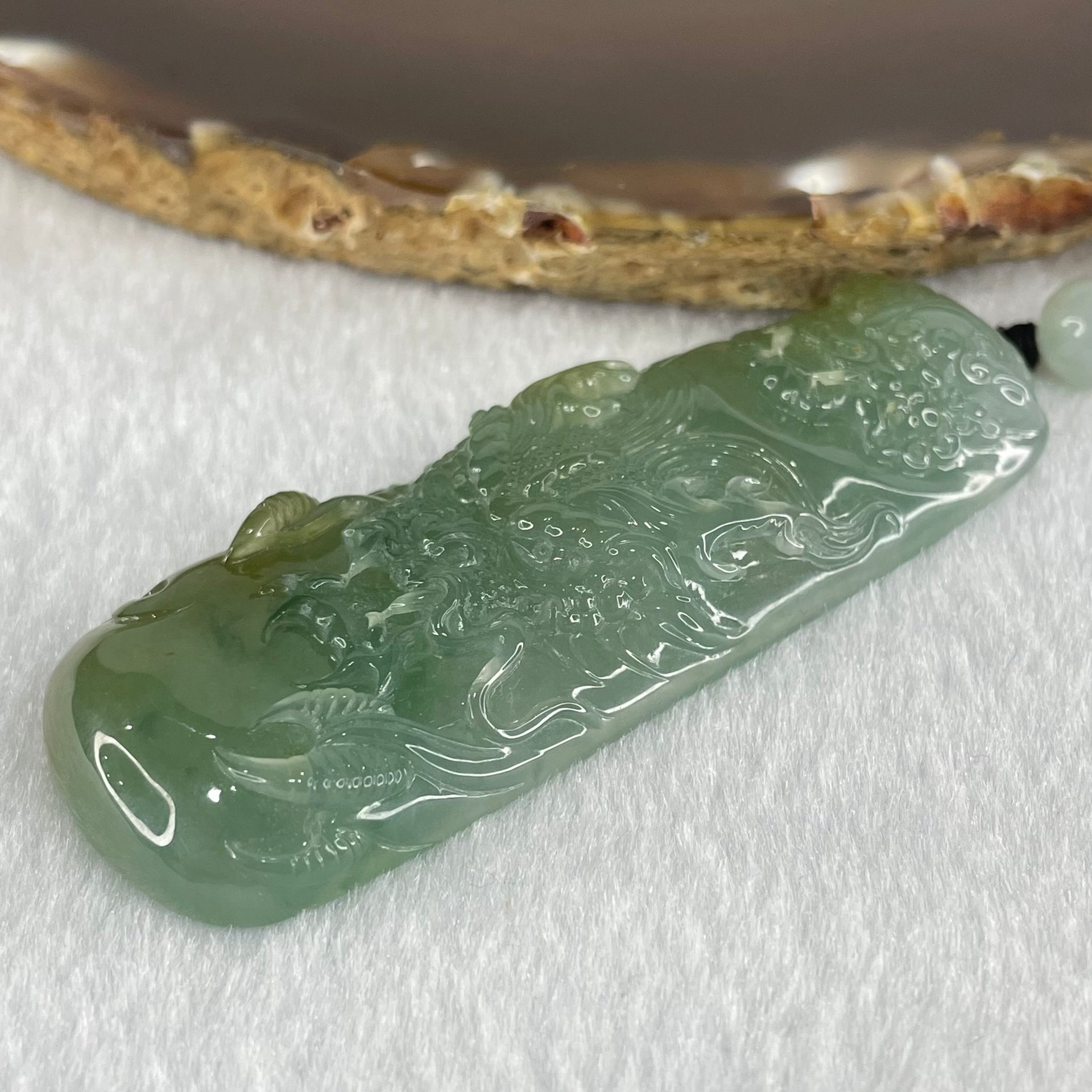 Grandmaster Type A Icy Blueish Green Jadeite Fu Gou on Dragon Pendant 30.95g 68 by 25 by 9.3mm - Huangs Jadeite and Jewelry Pte Ltd