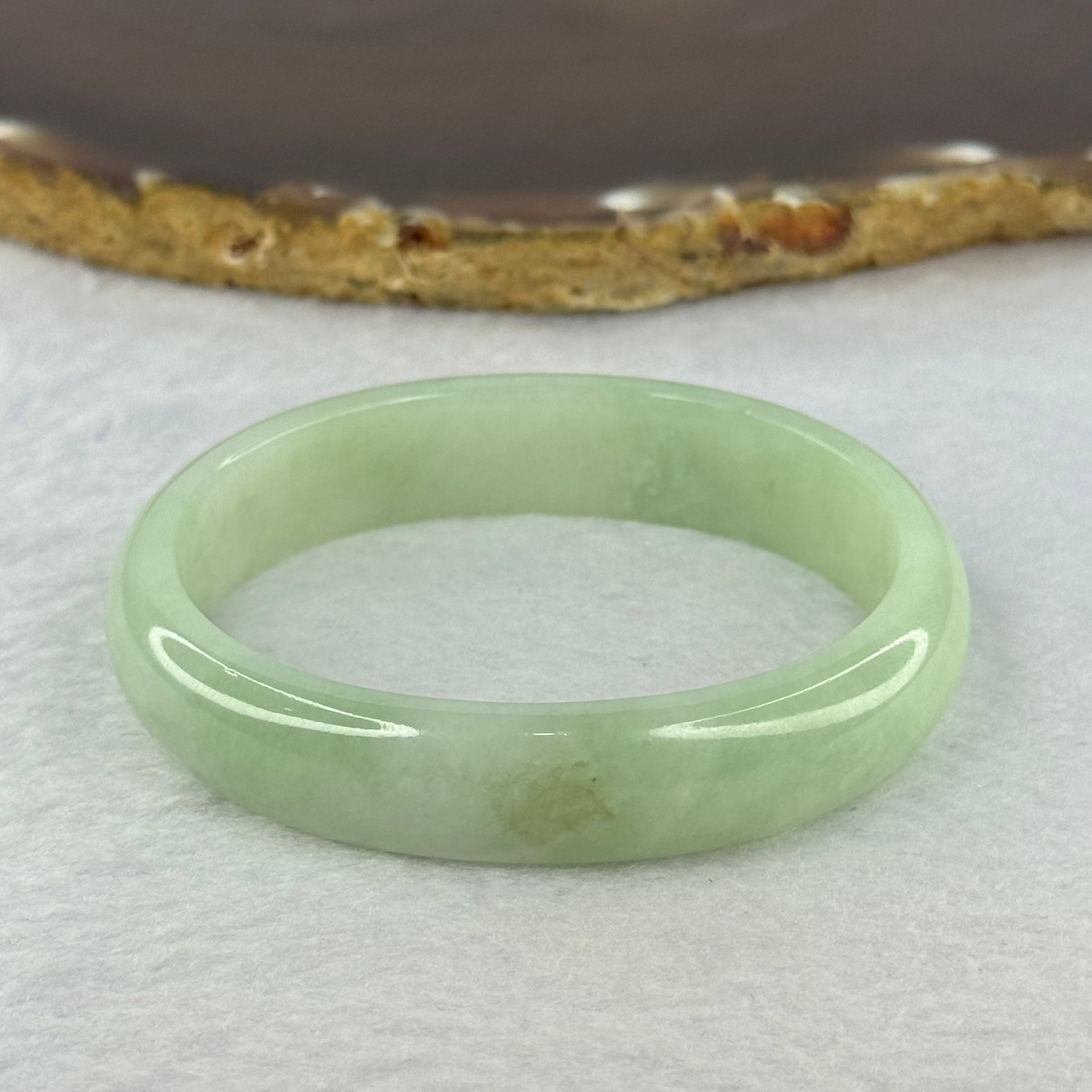 Type A Light Apple Green Jadeite Oval Bangle 33.35g Internal Diameter 52.3mm 12.2 by 6.5mm (Very Slight Fine Internal Lines) - Huangs Jadeite and Jewelry Pte Ltd
