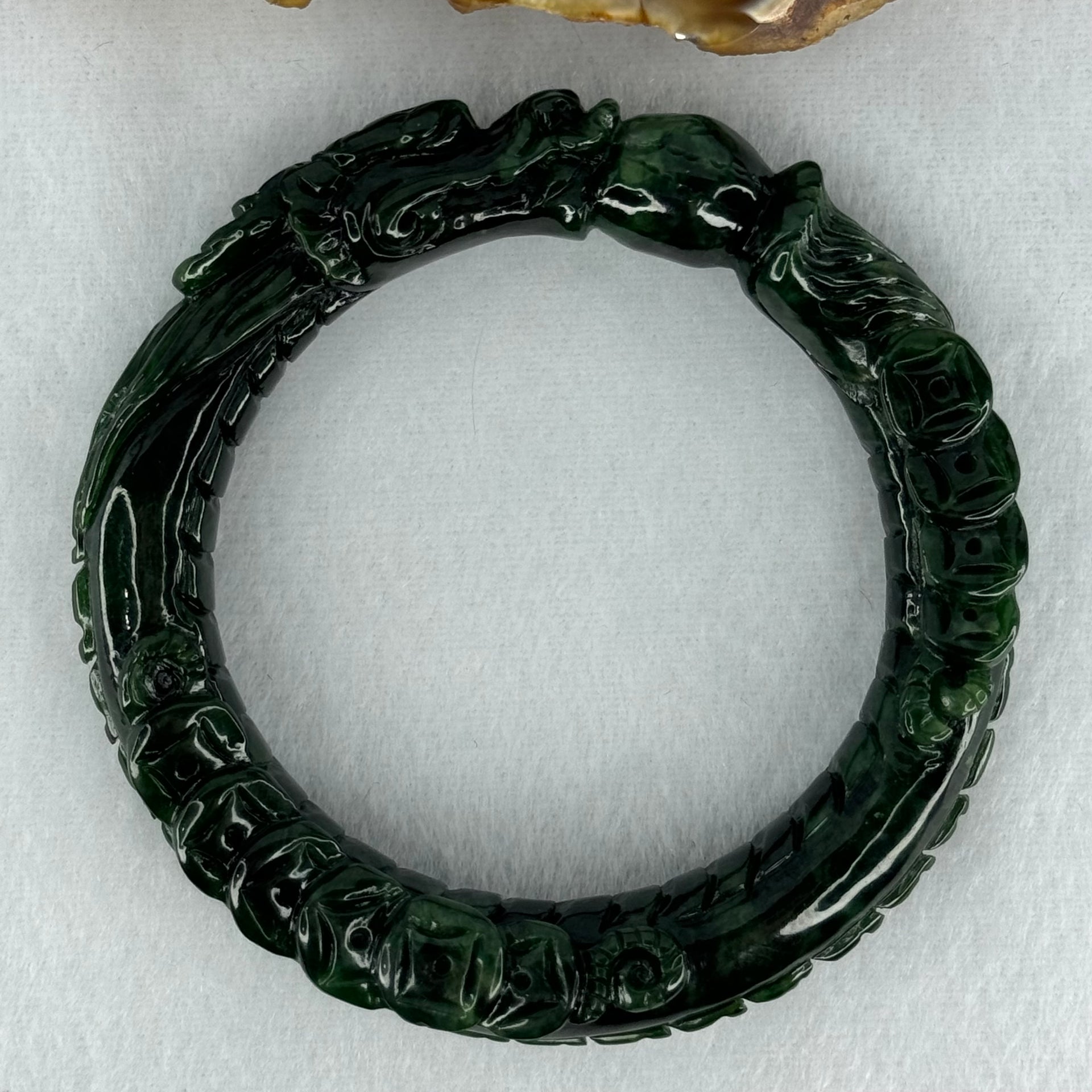 Type A Translucent to Opaque Old Mine Spicy Green Jadeite Dragon Bangle Internal Diameter 56.30mm 374.20cts 74.75g 16.0 by 12.5mm With NGI Cert 32885979 (Slight Internal Lines) - Huangs Jadeite and Jewelry Pte Ltd