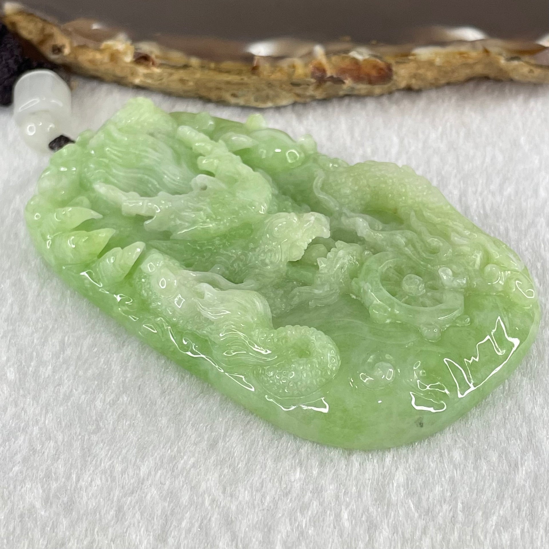 Type A Apple Green Jadeite Double Sided Fire Dragon Pendant 80.29g 75.3 by 44.4 by 13.2mm - Huangs Jadeite and Jewelry Pte Ltd