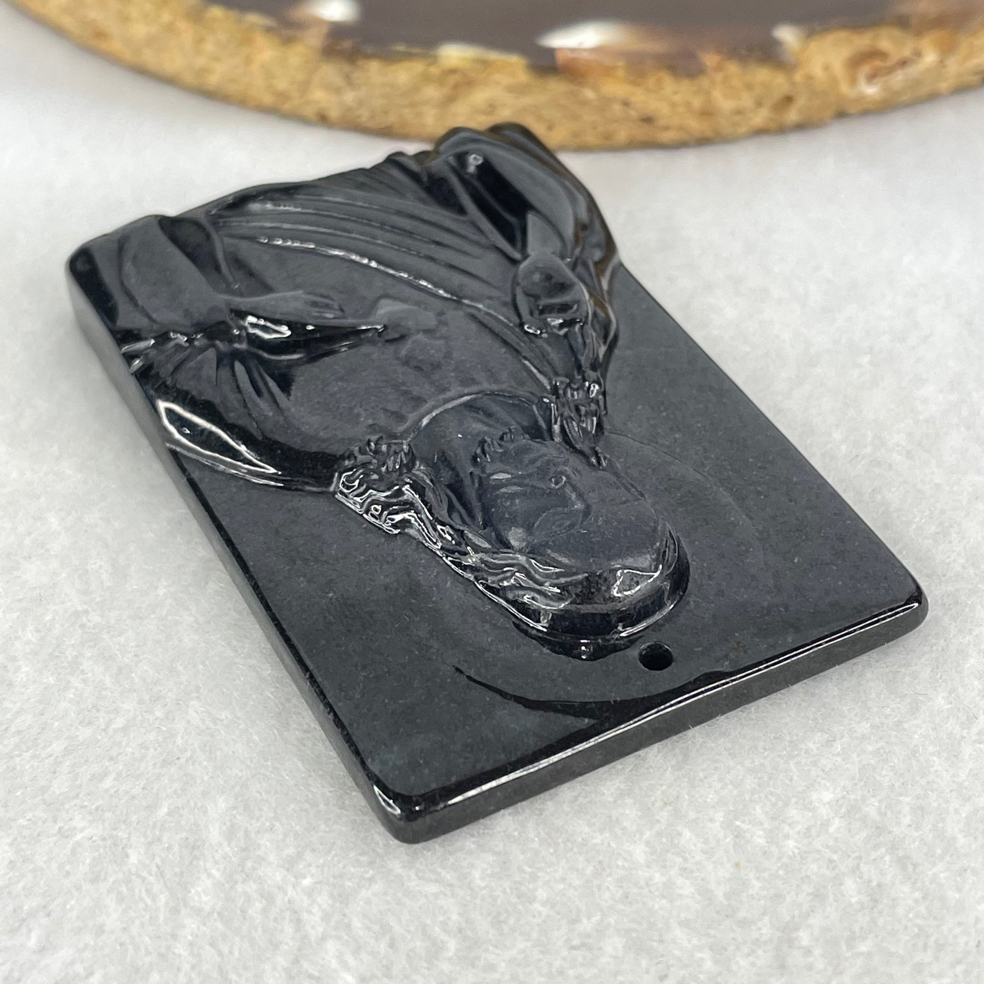 Type A Opaque Black Jadeite Jesus Christ Pendant 45.05g 58.8 by 38.9 by 8.8mm - Huangs Jadeite and Jewelry Pte Ltd