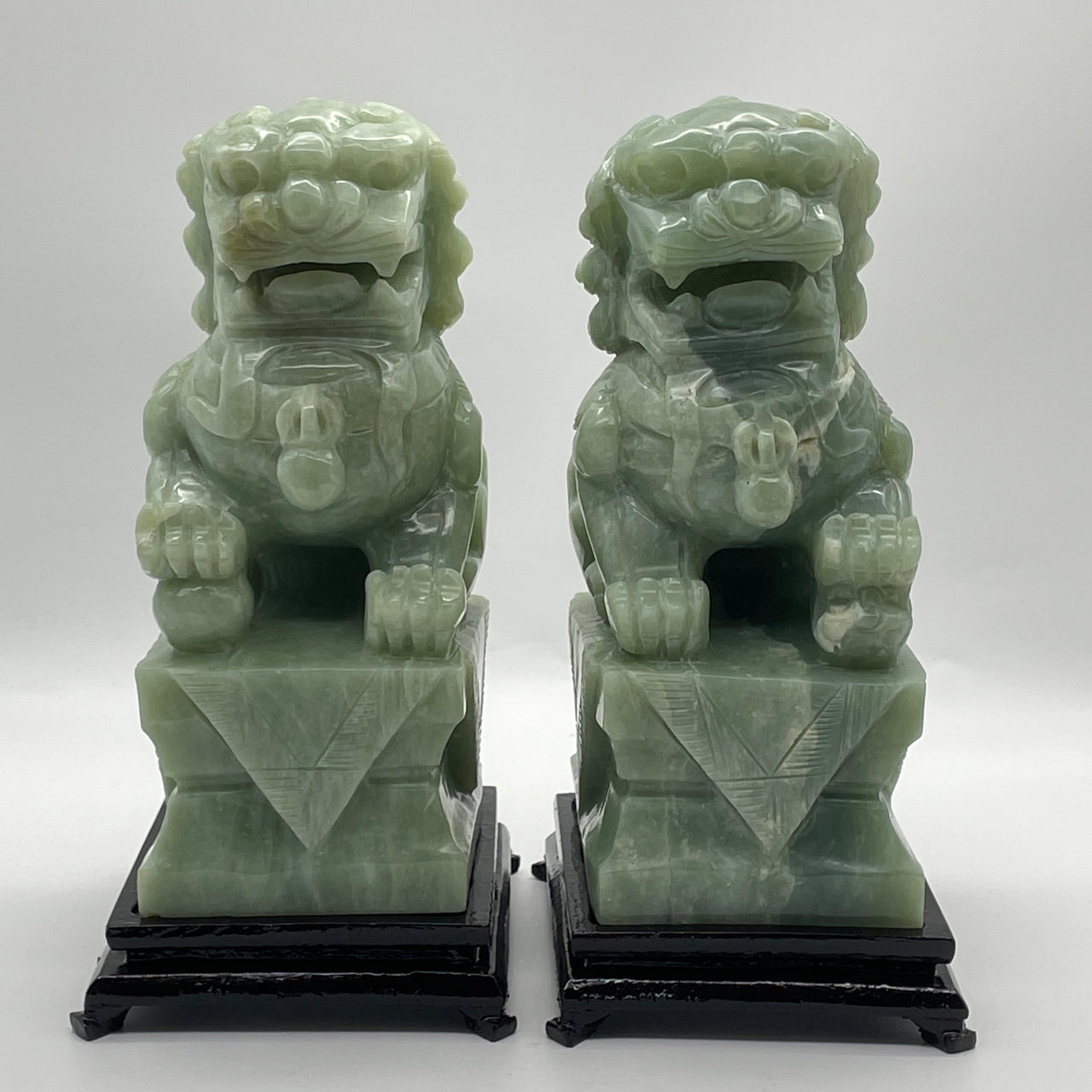 Natural Green Serpentine Pair of Fu Gou with Wooden Stand Display 3,211.8g 139.0 by 110.0 by 235.0mm and 3,313.9g 135.0 by 108.5 by 235.0mm