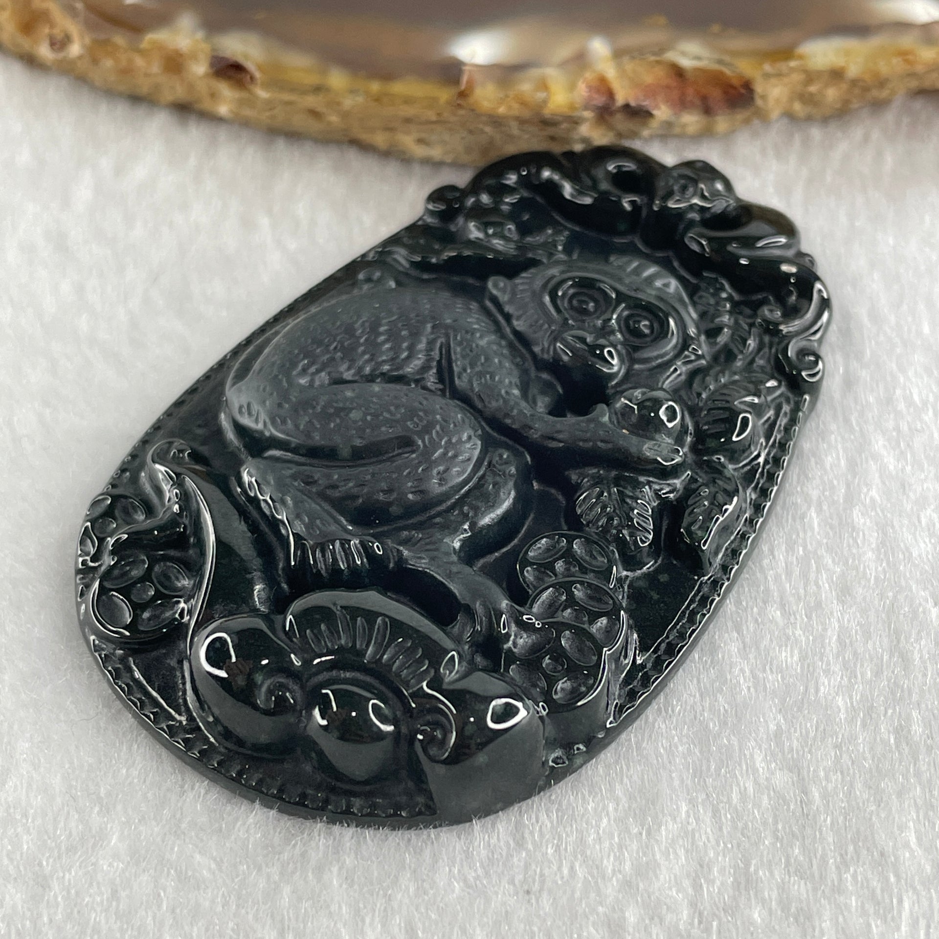 Type A Opaque to Partial Translucent Black Omphacite Jadeite Monkey Pendant 29.60g 59.6 by 40.1 by 8.5mm - Huangs Jadeite and Jewelry Pte Ltd