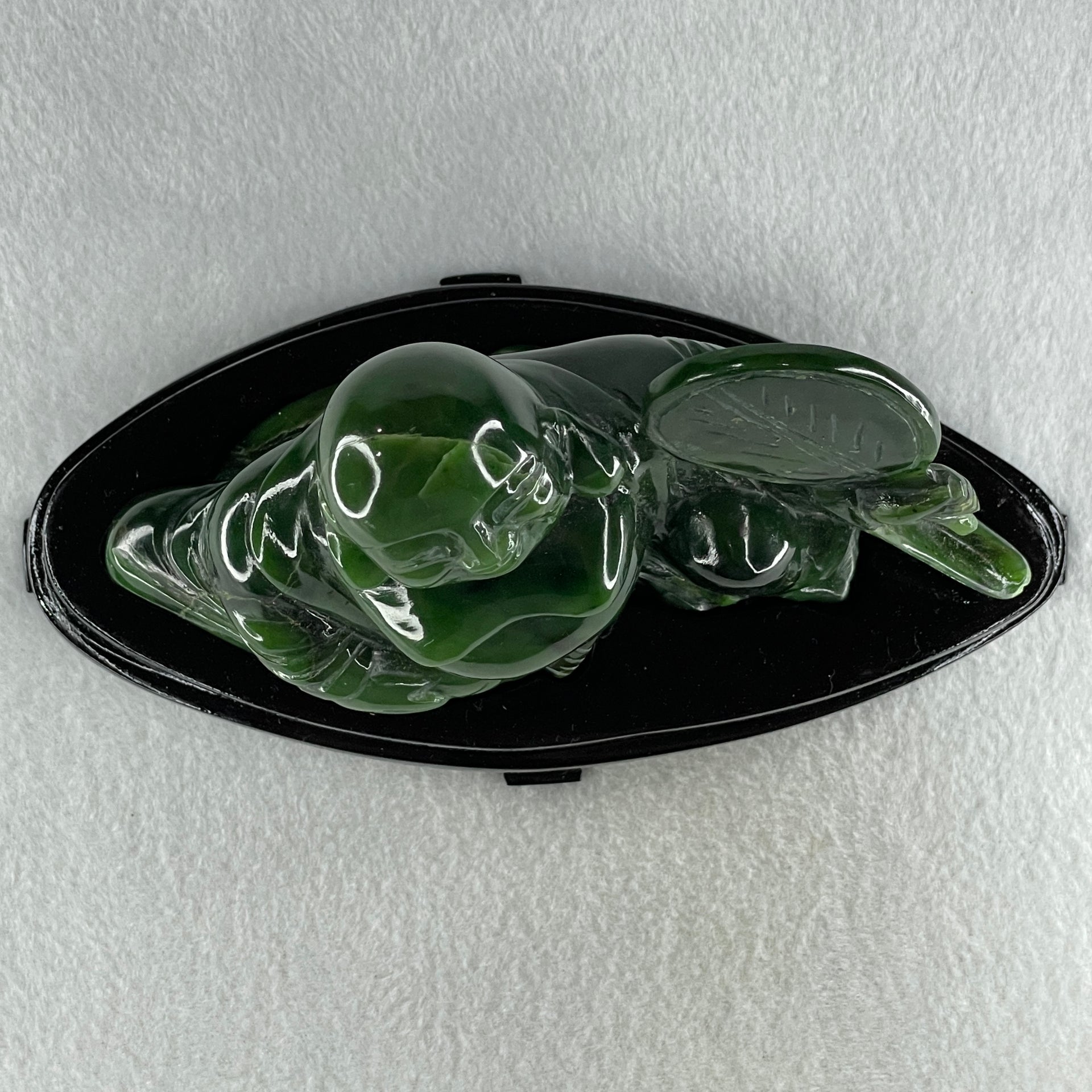 Natural Dark Green Serpentine Siting Milo Buddha with Waving Fan with Wooden Stand Display 765.0g 180.0 by 90.0 by 115.0mm - Huangs Jadeite and Jewelry Pte Ltd