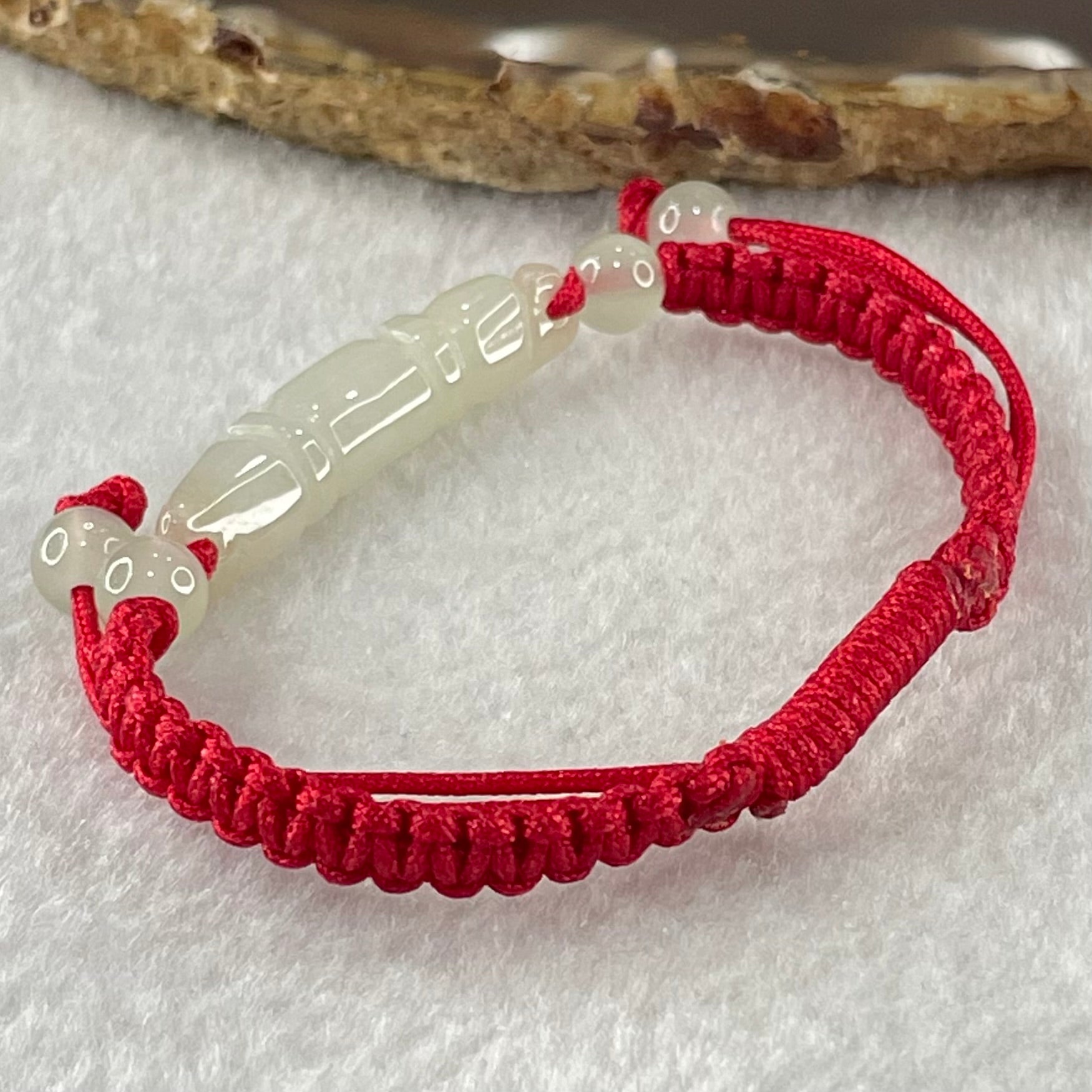 Type A Light Green Jadeite Scholarship Brush in Red String Bracelet 5.57g 6.7 by 7.5 by 33.5mm - Huangs Jadeite and Jewelry Pte Ltd