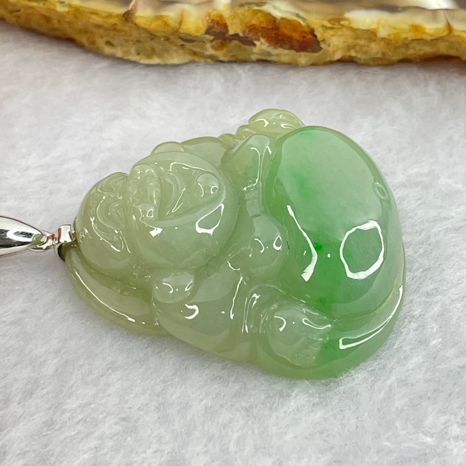 18K 750 White Gold Type A Green with Apple Green Milo Buddha Pendant 20.73g 34.3 by 35.3 by 10.80mm - Huangs Jadeite and Jewelry Pte Ltd
