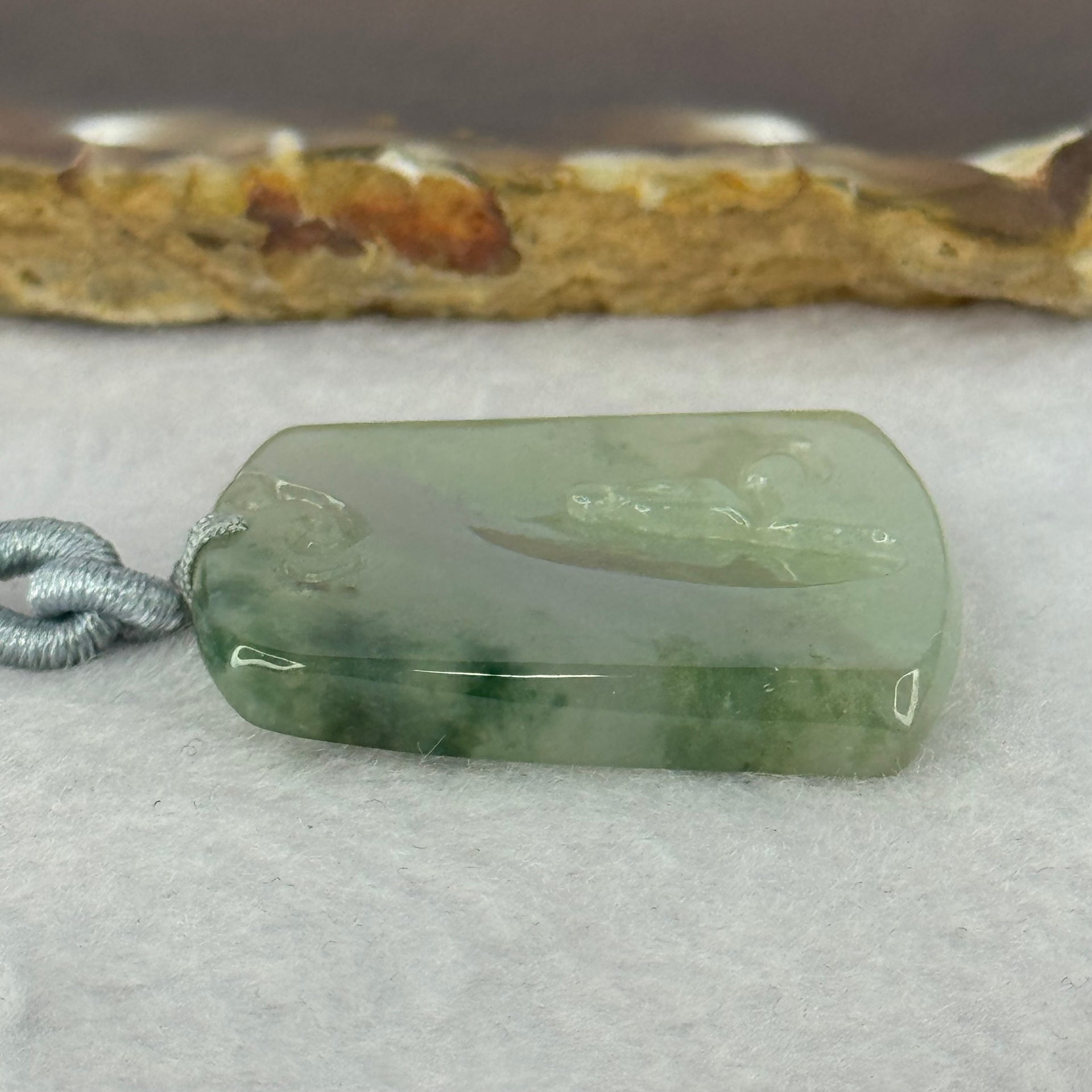 Type A Semi Icy Green Piao Hua Jadeite Shan Shui with Benefactor Gui Ren Pendent 13.79g 34.8 by 27.7 by 4.9mm - Huangs Jadeite and Jewelry Pte Ltd