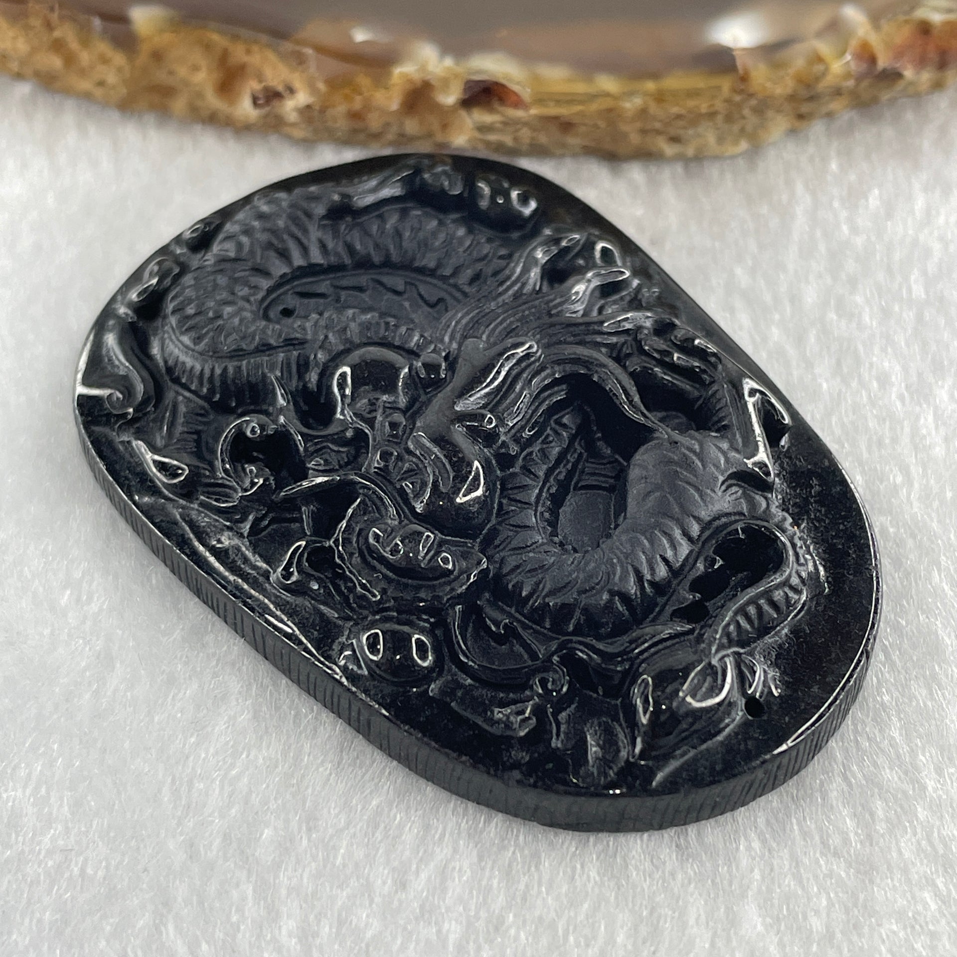 Type A Opaque to Partial Translucent Black Omphacite Jadeite Dragon Pendant 24.58g 58.2 by 40.3 by 8.2mm - Huangs Jadeite and Jewelry Pte Ltd