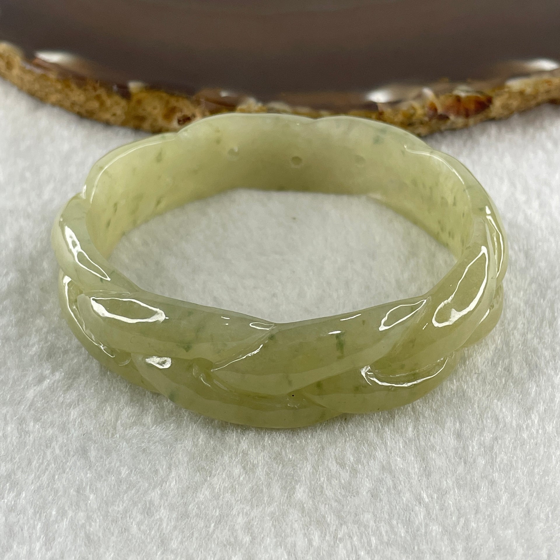 Type A Natural Yellowish Green Jadeite Oval Carved Bangle 41.73g Inner Diameter 54.2mm 16.5 by 7.1mm (Very Very Slight Internal Lines) - Huangs Jadeite and Jewelry Pte Ltd