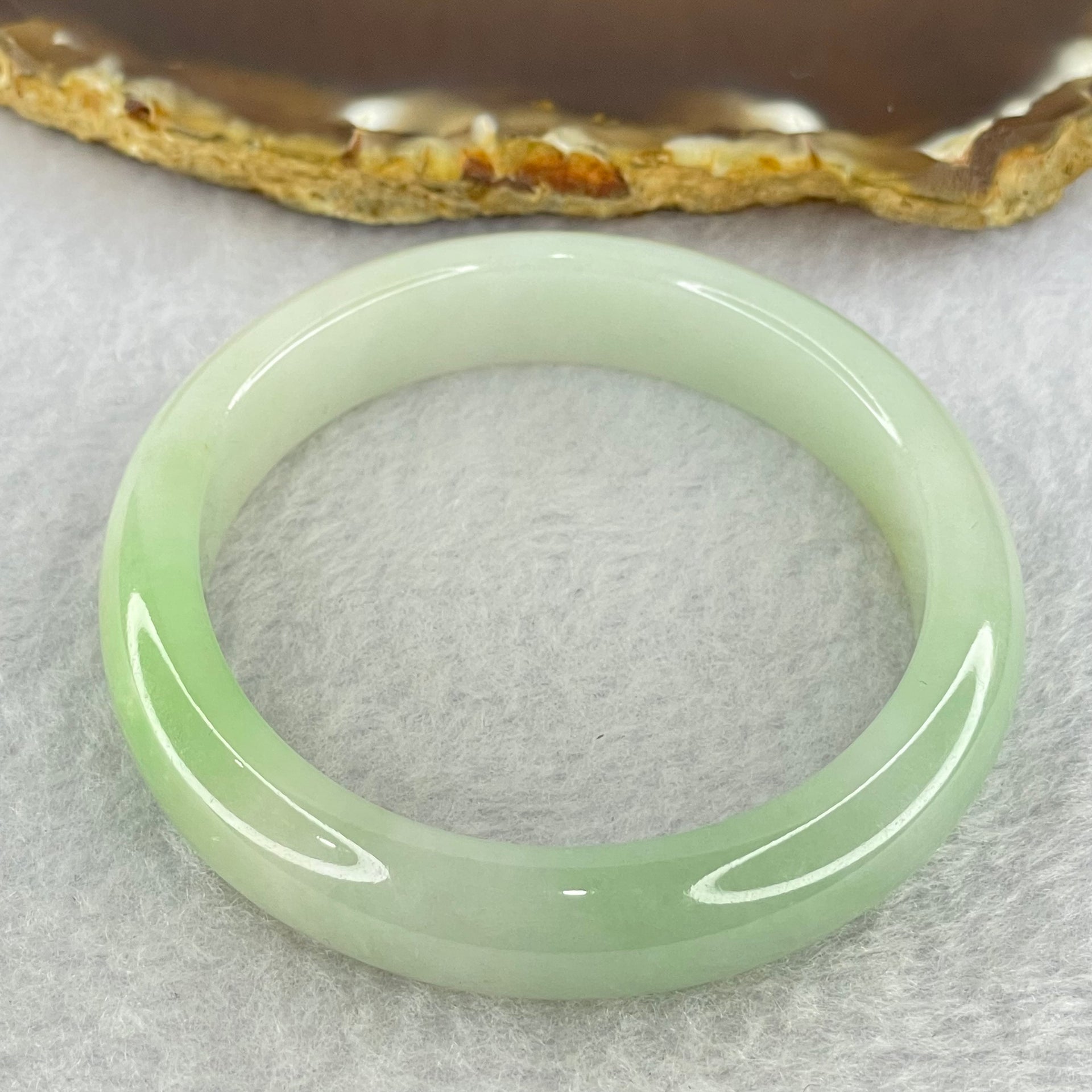 Type A Light Green Jadeite Oval Bangle Internal Diameter 56.2mm 40.54g 11.1 by 7.2mm (Slight Internal Line) - Huangs Jadeite and Jewelry Pte Ltd
