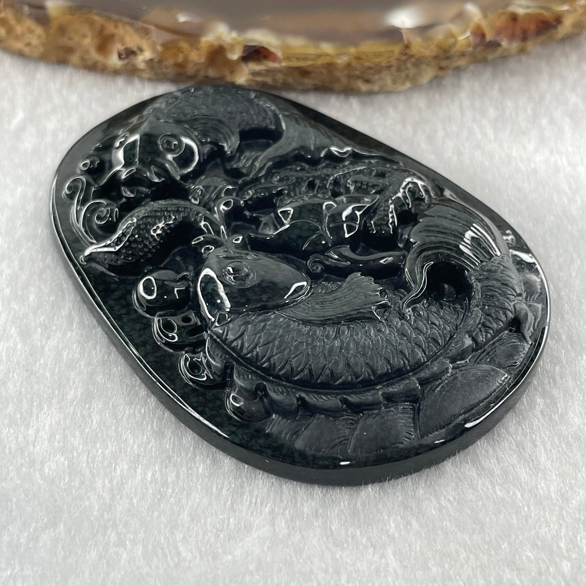 Type A Opaque to Partial Translucent Black Omphacite Jadeite Double Fish with Lotus Flower and Coins Pendant 29.11g 61.1 by 44.1 by 9.2mm - Huangs Jadeite and Jewelry Pte Ltd