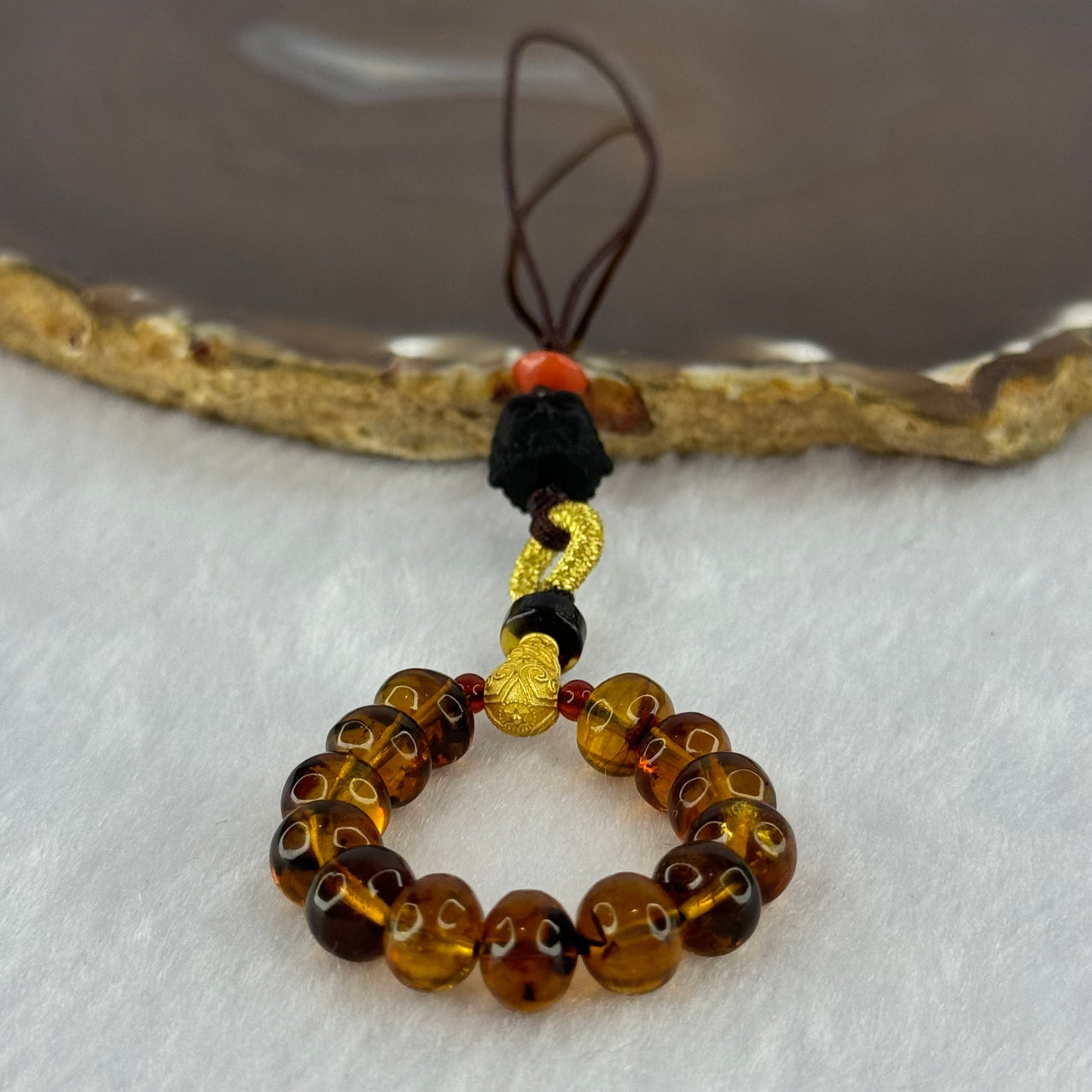 Natural Cognac Amber with Damo Head Handphone Strap 4.30g 7.6mm 13 Beads - Huangs Jadeite and Jewelry Pte Ltd