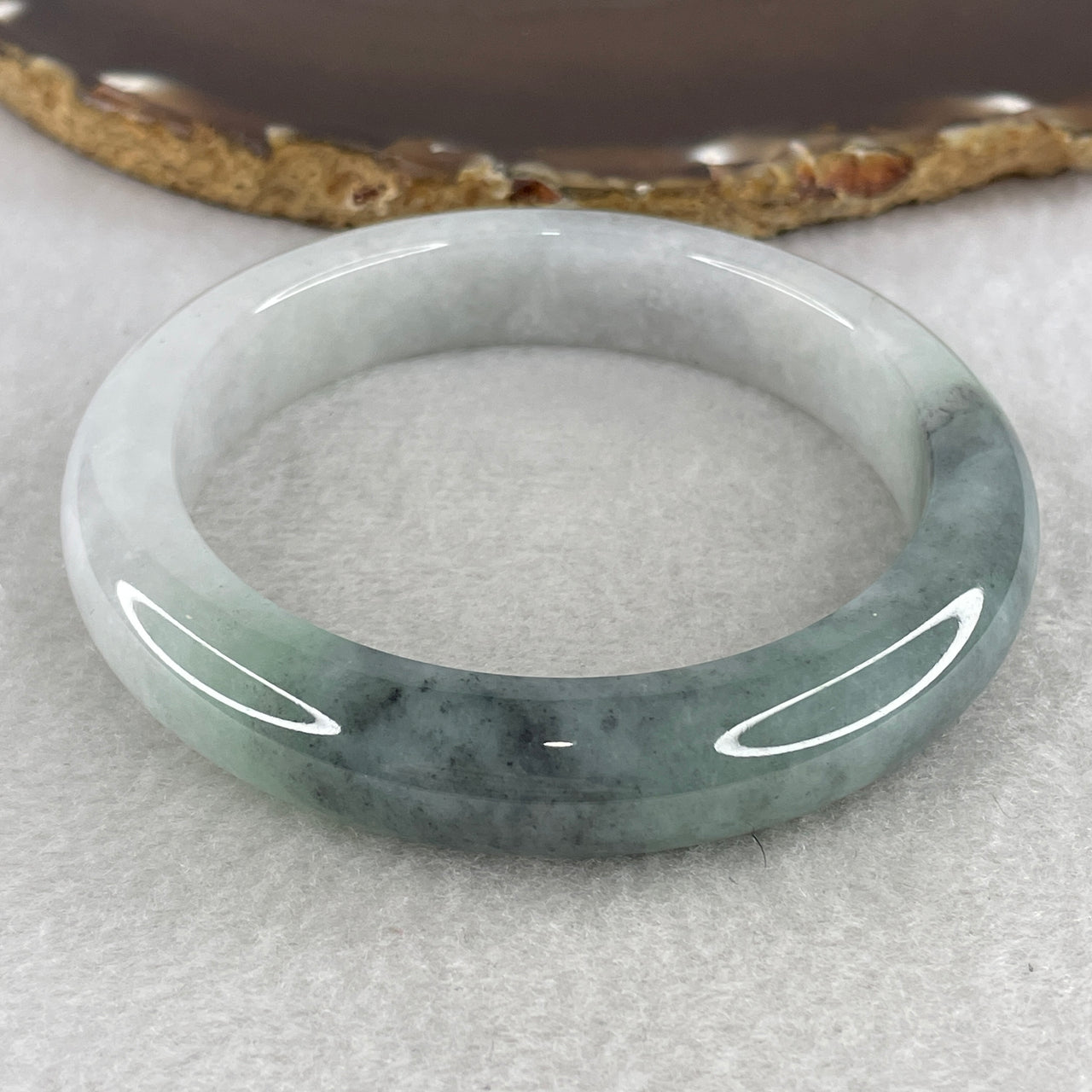 Natural Type A Translucent Jadeite Bangle | 59.7mm Faint Blueish-Green with Intense Blueish-Green Patch | "Close to Perfect" Substantive "Lan Shui" Round Wrist Heirloom (69.98g 12.4x9.3mm)