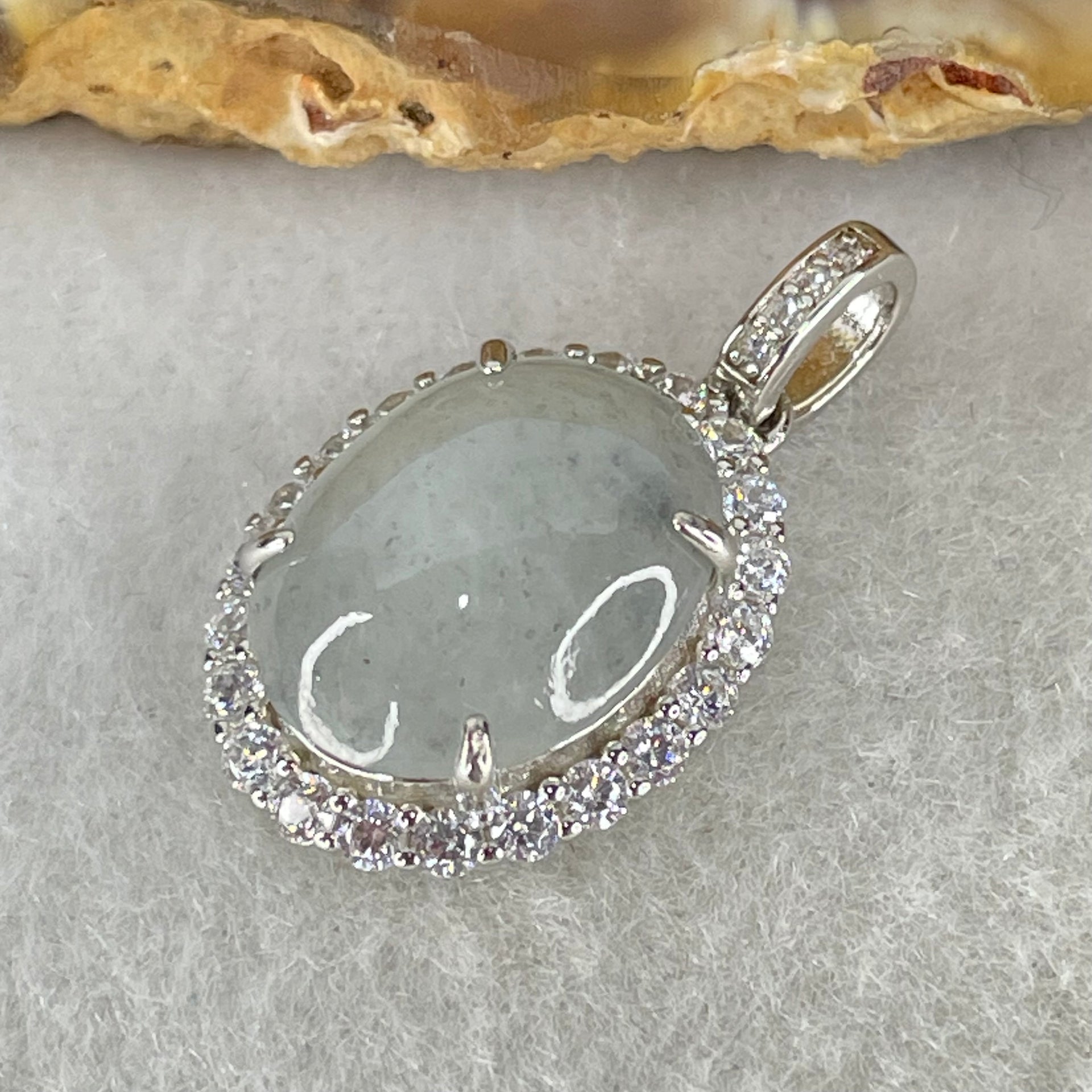 Type A Icy Green With Wuji Grey Spots Cabochon Jadeite in S925 Sliver Crystal Charm 2.85g 13.9 by 10.9 by 5.0mm - Huangs Jadeite and Jewelry Pte Ltd