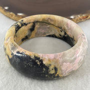 Entry Grade Natural Yellow with Black Rhodonite Bangle 105.93g Inner Diameter 55.2mm 25.5 by 11.7mm - Huangs Jadeite and Jewelry Pte Ltd