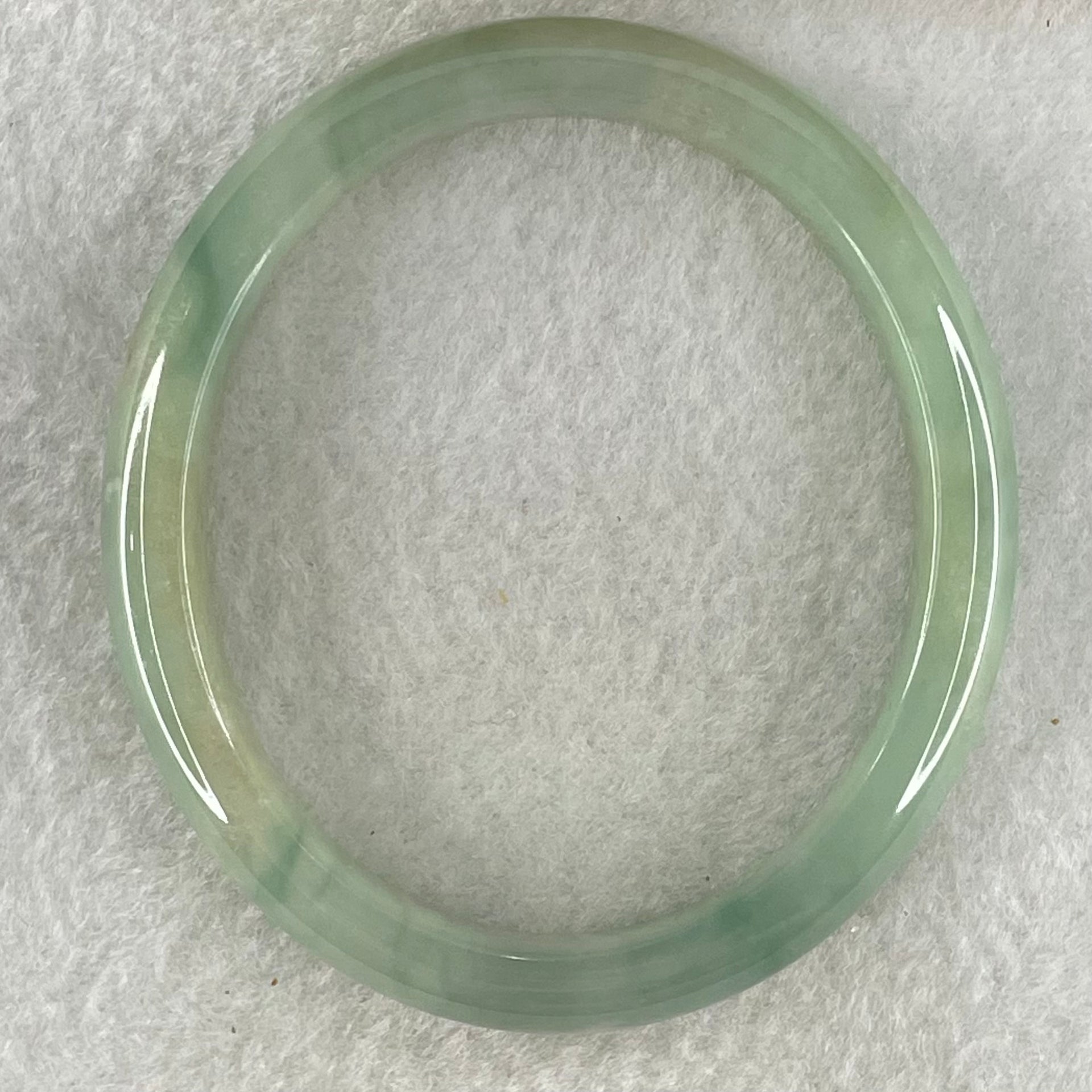 Type A Jelly Green Jadeite Oval Bangle 32.70g Internal Diameter 54.6mm 10.2 by 6.4mm (Close to Perfect) - Huangs Jadeite and Jewelry Pte Ltd