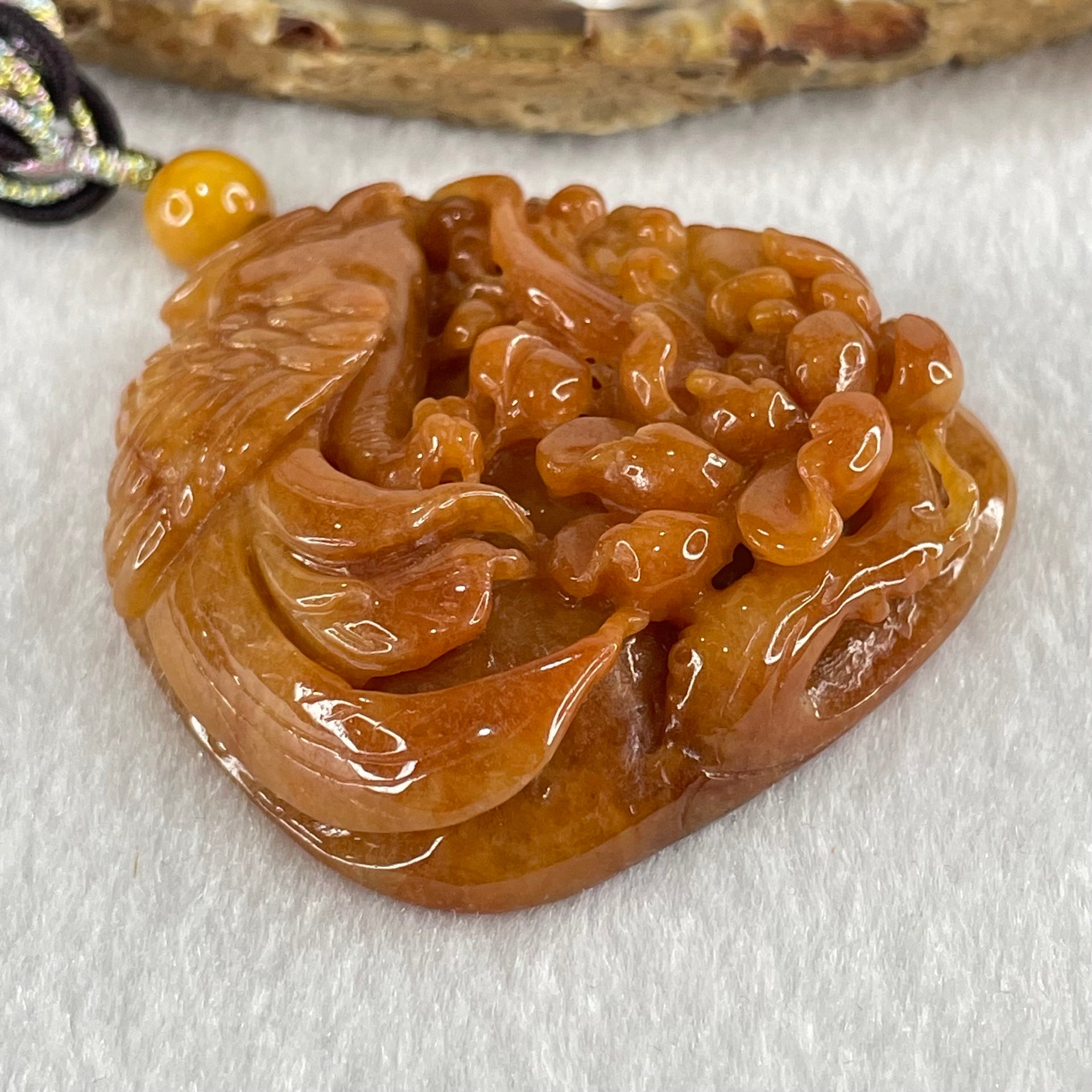 Grandmaster Type A Translucent Brownish Orange to Brownish Red with Light Blueish Green Jadeite Bird with Flower 花开富贵 Pendant 53.67g 49.27 by 46.37 by 12.66mm With NGI Cert 82838746 - Huangs Jadeite and Jewelry Pte Ltd