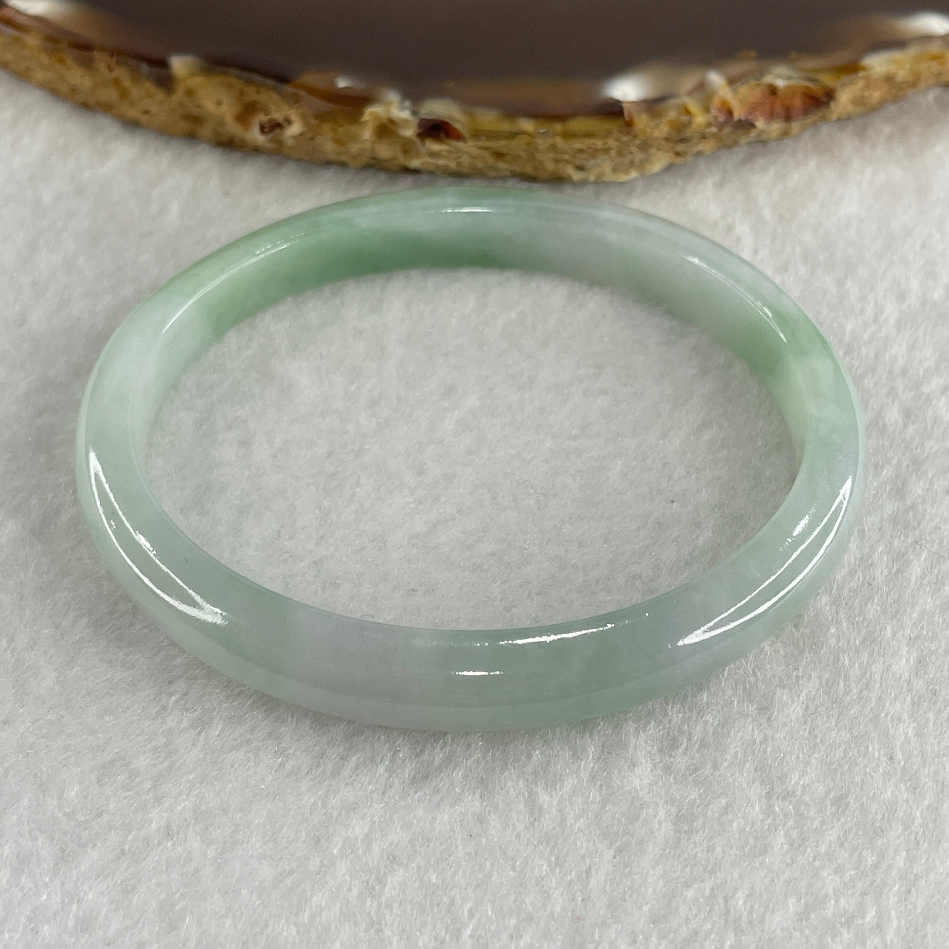 Certified Type A Light Green with Green Patches Jadeite Oval Bangle Internal Diameter 54.3mm 20.69g 7.5 by 6.4mm ( Very Slight Internal Lines ) - Huangs Jadeite and Jewelry Pte Ltd