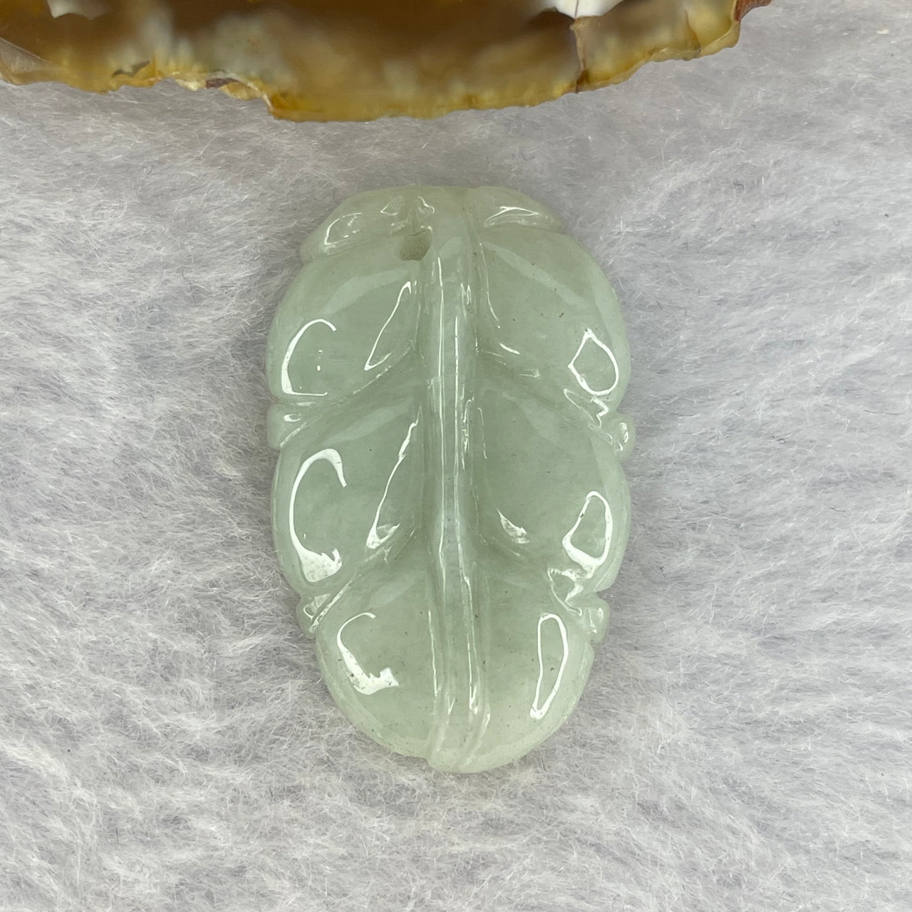 A Light Green Jadeite Leaf for Overnight Success 一夜发财 7.86g 32.6 by 20.8 by 6.1mm - Huangs Jadeite and Jewelry Pte Ltd