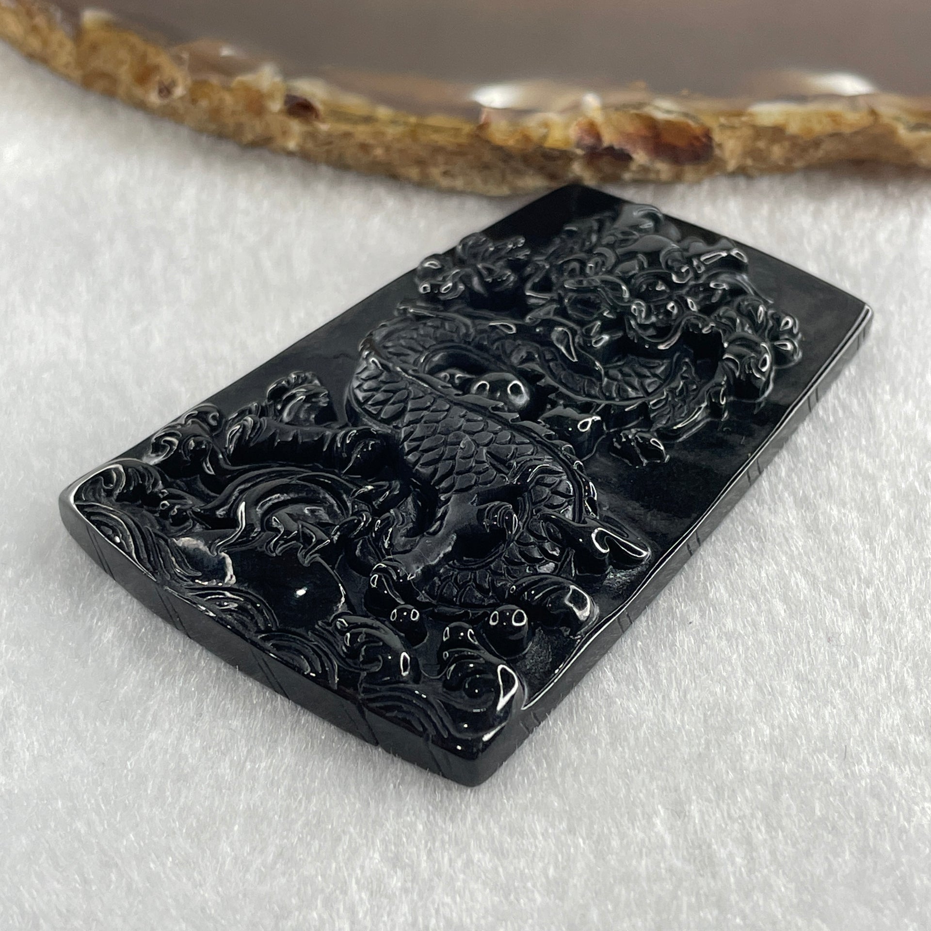 Type A Opaque to Partial Translucent Black Omphacite Jadeite Dragon Pendant 30.25g 64.4 by 42.8 by 8.2mm - Huangs Jadeite and Jewelry Pte Ltd