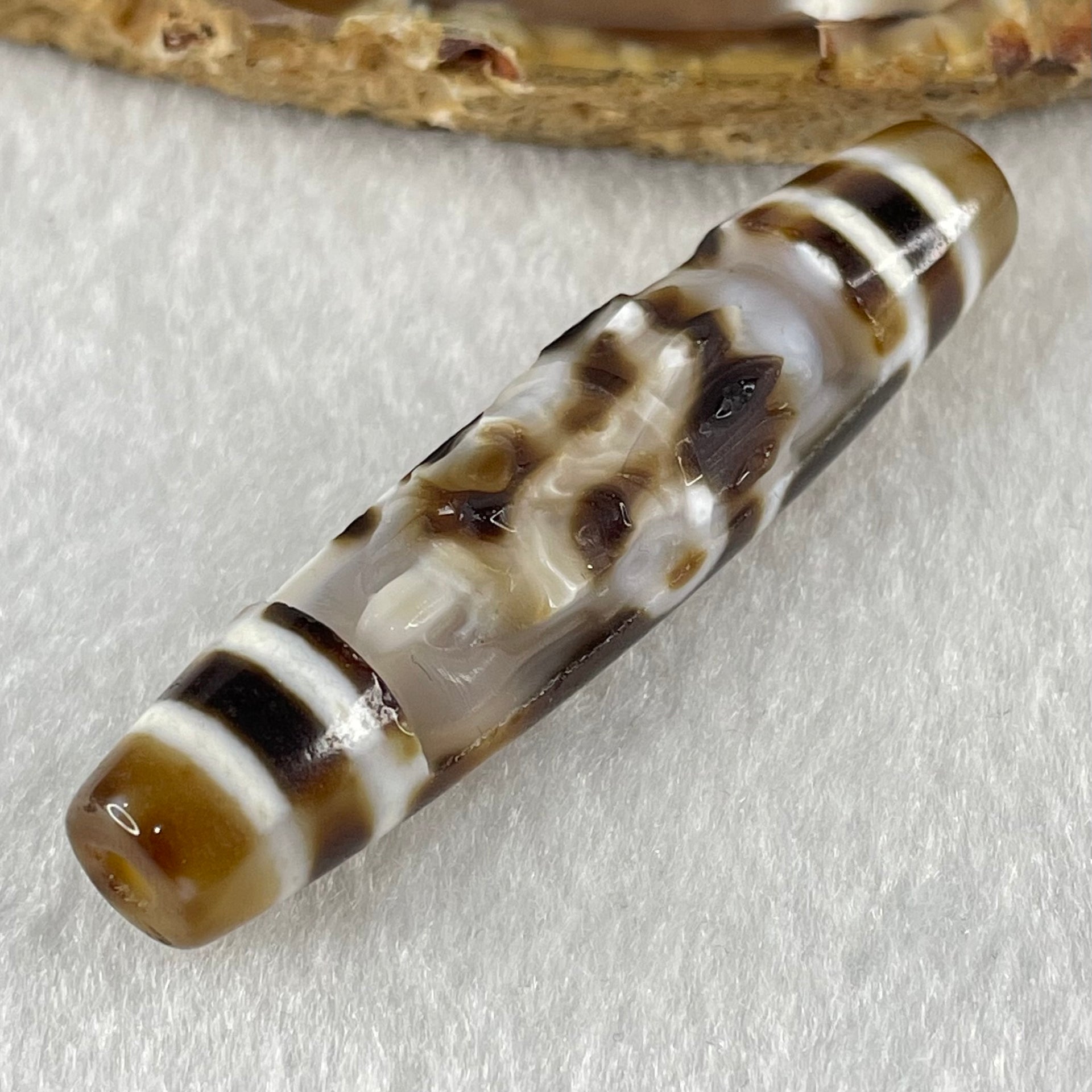Natural Powerful Tibetan Old Oily Agate Zha Ji La Mu Female Cai Shen Carvings on 9 Eyes Dzi Bead Heavenly Master (Tian Zhu) 九眼扎基拉姆女财神天珠 13.88g 57.4 by 13.3mm - Huangs Jadeite and Jewelry Pte Ltd