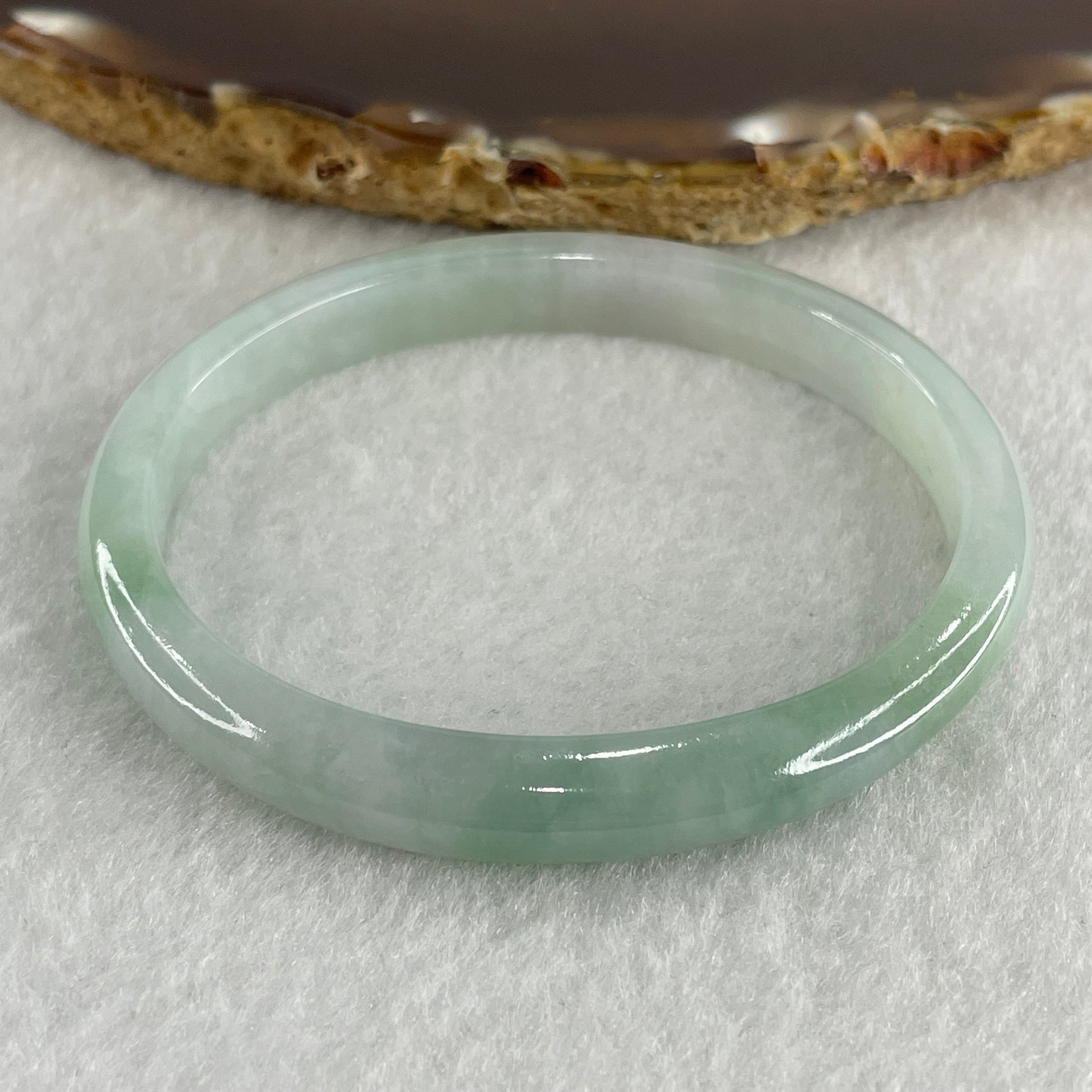 Certified Type A Light Green with Green Patches Jadeite Oval Bangle Internal Diameter 54.3mm 20.69g 7.5 by 6.4mm ( Very Slight Internal Lines ) - Huangs Jadeite and Jewelry Pte Ltd