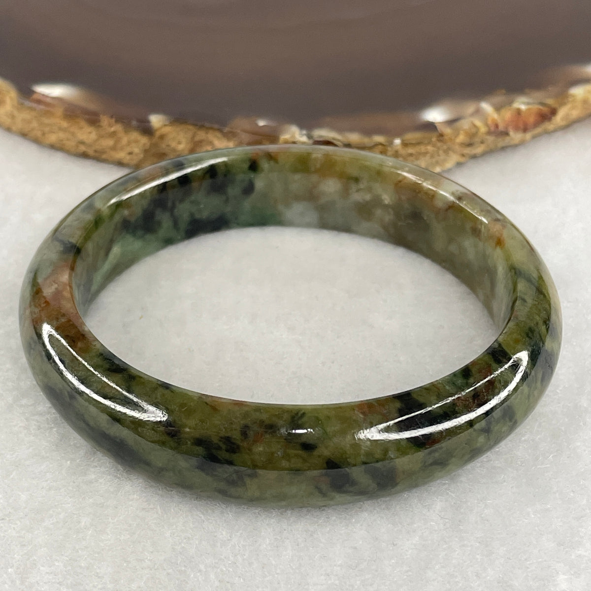 Natural Type A Jadeite Bangle | Oval Guifei Dark Green & Earthy Brown Piao Hua (50.08g | 54.4mm Inner Diameter | 13.4 x 7.8mm) (External Rough, Internal Line)