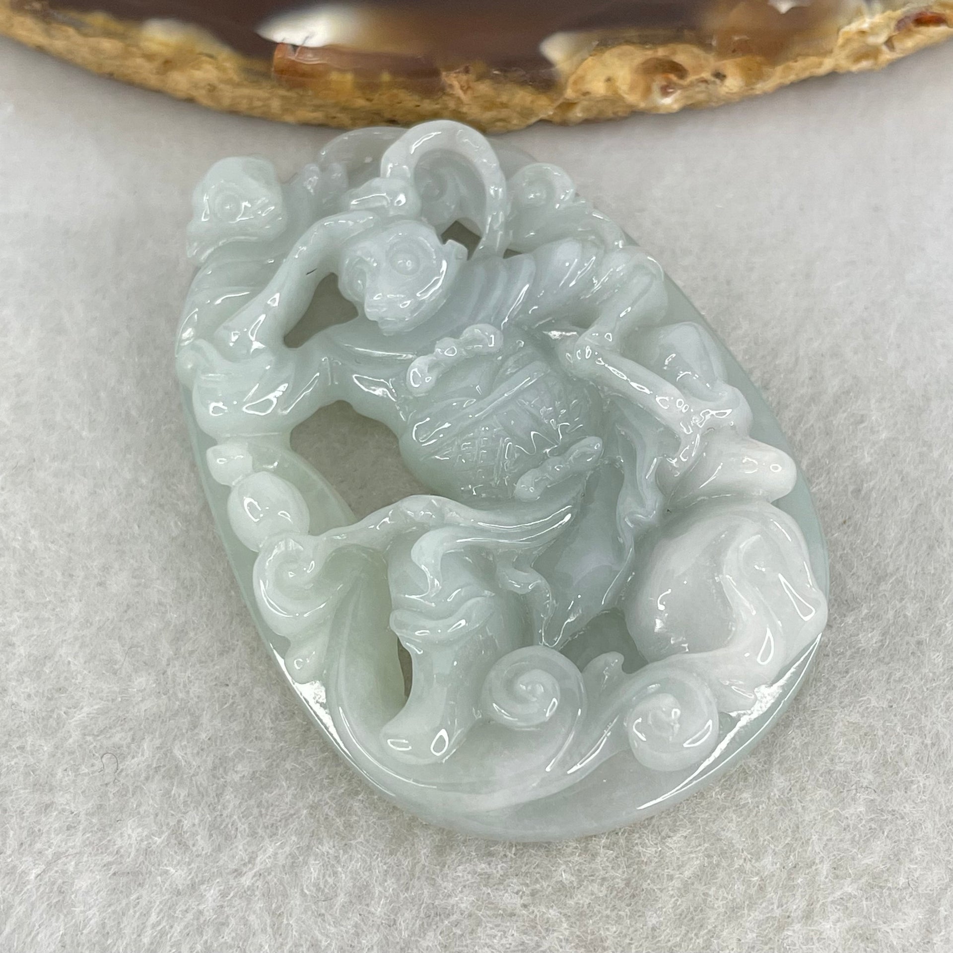 Type A Light Sky Blue Jadeite Sun Wu Kong Pendant 27.49g 52.8 by 37.1 by 11.0mm - Huangs Jadeite and Jewelry Pte Ltd