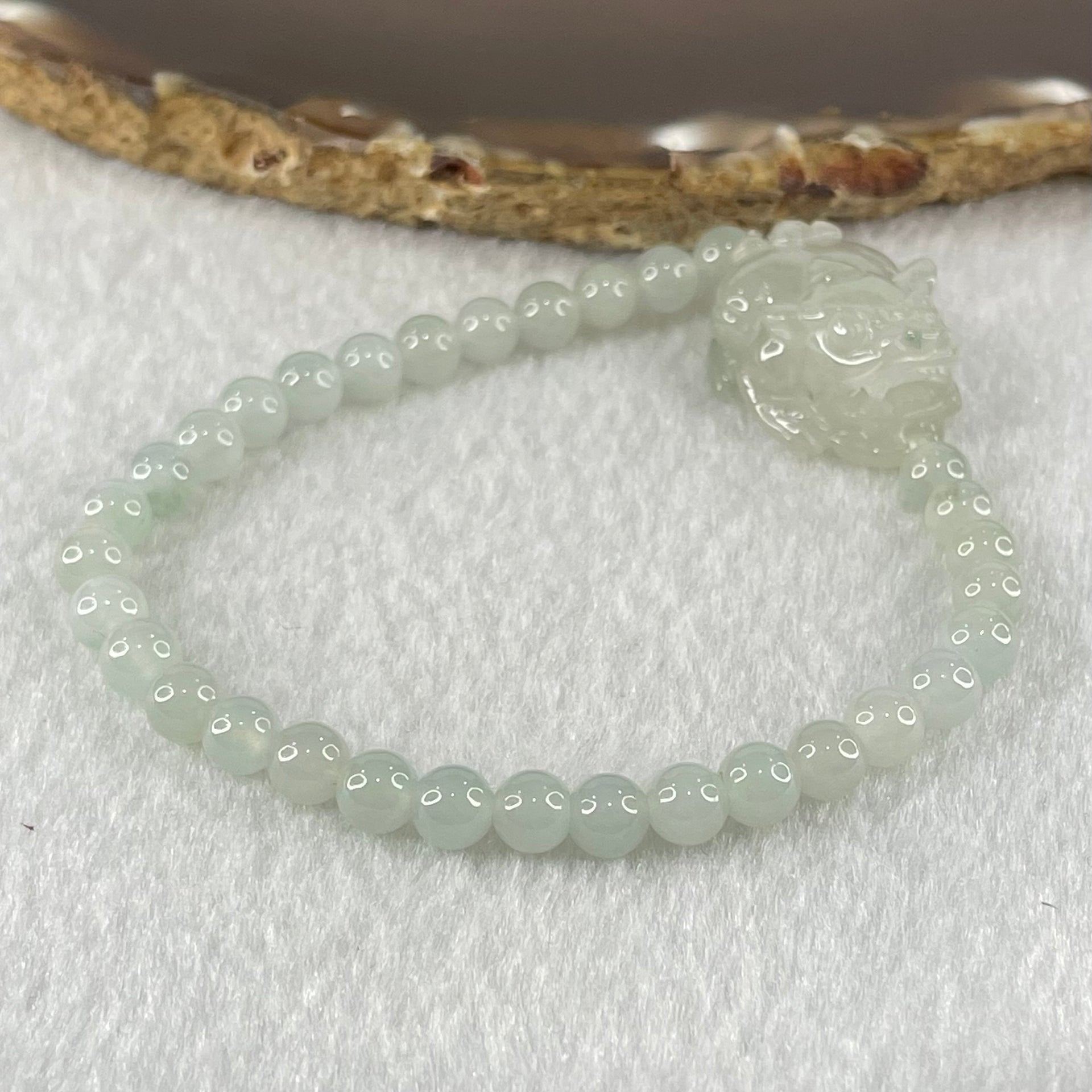 Special Type A Semi Icy Light Blueish Green Jadeite with Male Pixiu Charm Bracelet 5.61g 16cm 5.4mm 32 Beads 22.4 by 11.4 by 11.8mm 1pcs - Huangs Jadeite and Jewelry Pte Ltd