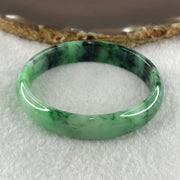 Type A Natural Old Mine Spicy Green with Dark Green Piao Hua Flora Jadeite Oval Bangle 26.28g 131.60cts Inner Diameter 52.55mm 46.90 by 5.40mm with NGI Cert 63804952 (Very Very Slight Internal Lines) - Huangs Jadeite and Jewelry Pte Ltd