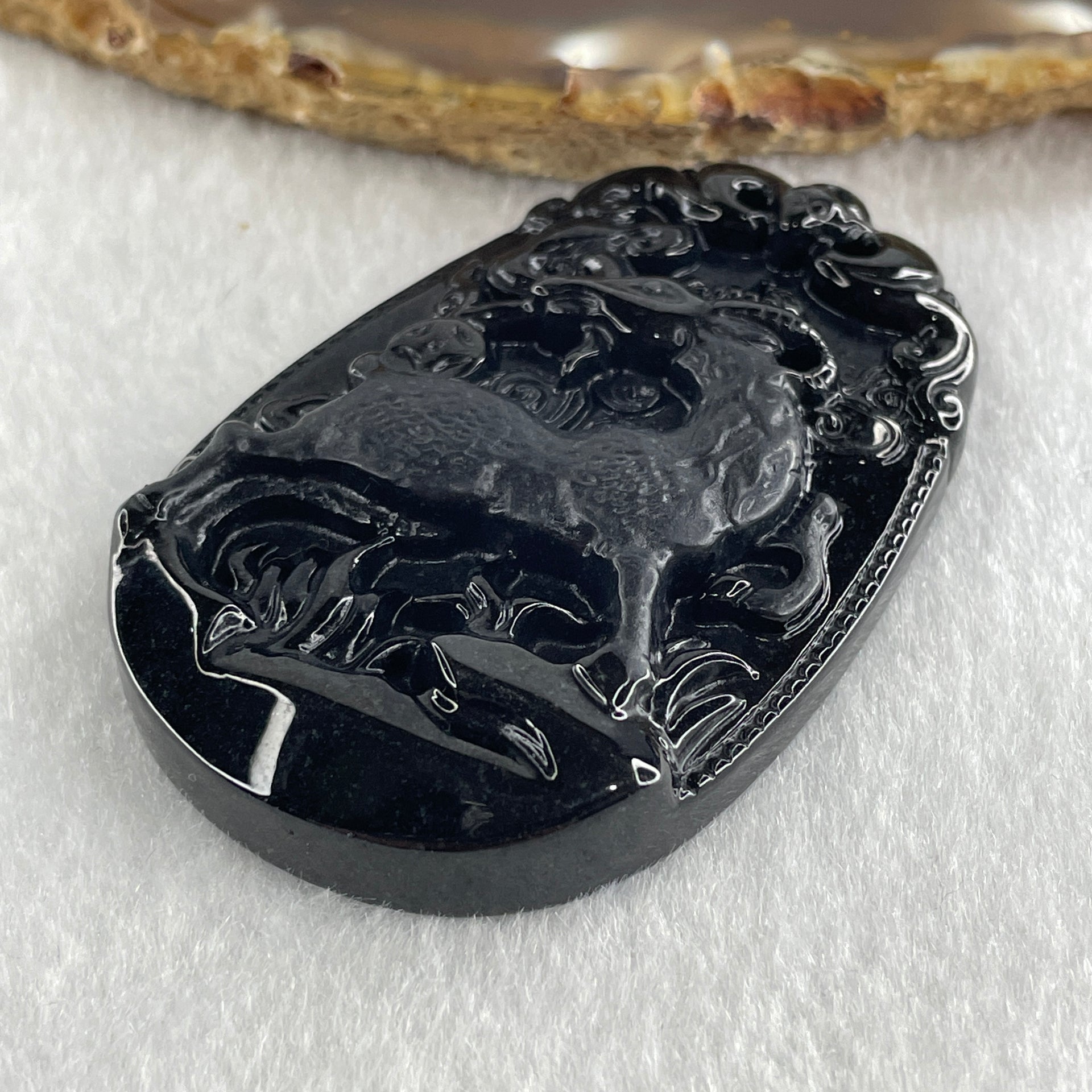 Type A Opaque to Partial Translucent Black Omphacite Jadeite Goat Pendant 27.85g 59.9 by 40.6 by 9.8mm - Huangs Jadeite and Jewelry Pte Ltd