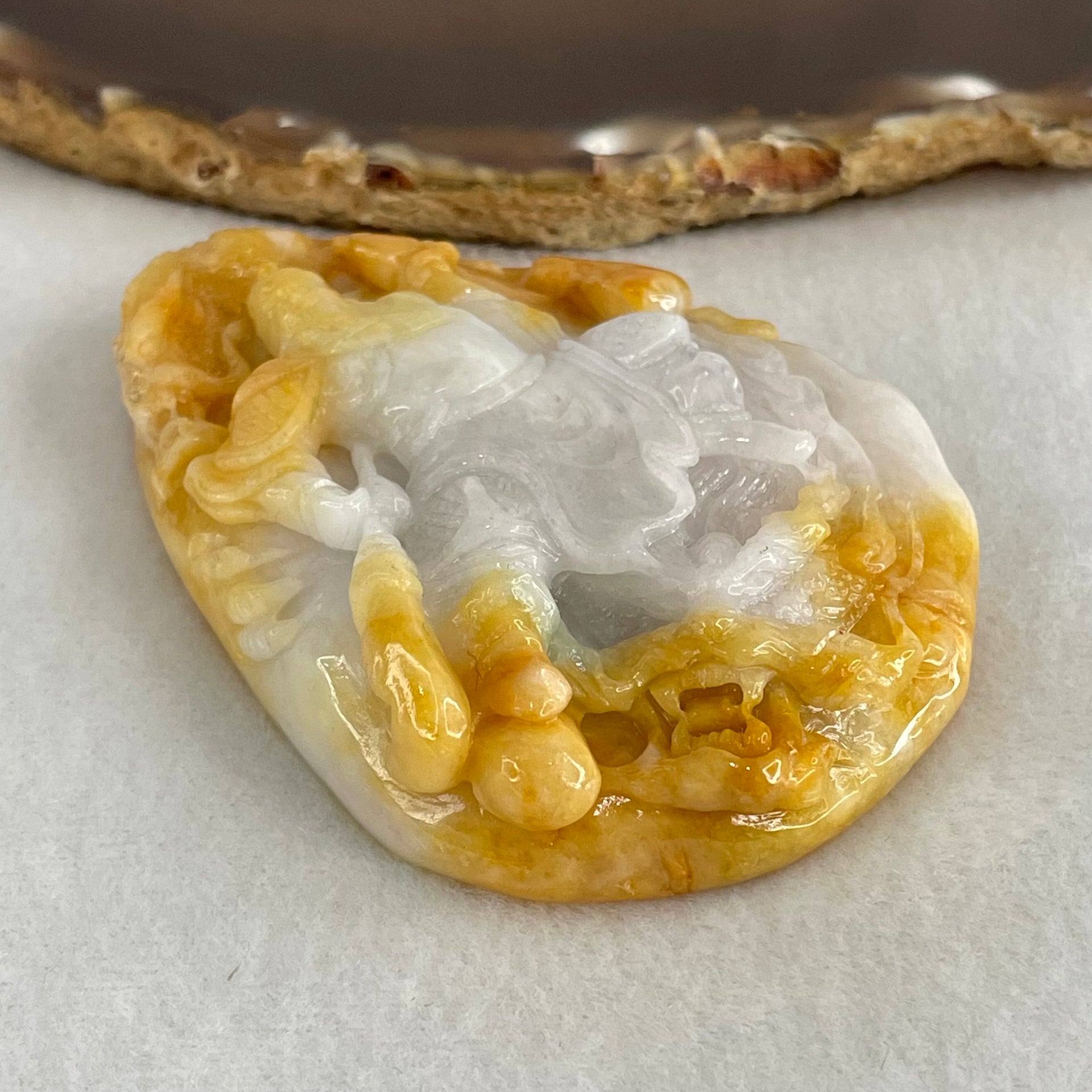 Type A Yellow with Faint Lavender Green Jadeite Guan Gong with Double Dragons 116.28g 75.0 by 54.0 by 16.8mm (Burned) - Huangs Jadeite and Jewelry Pte Ltd