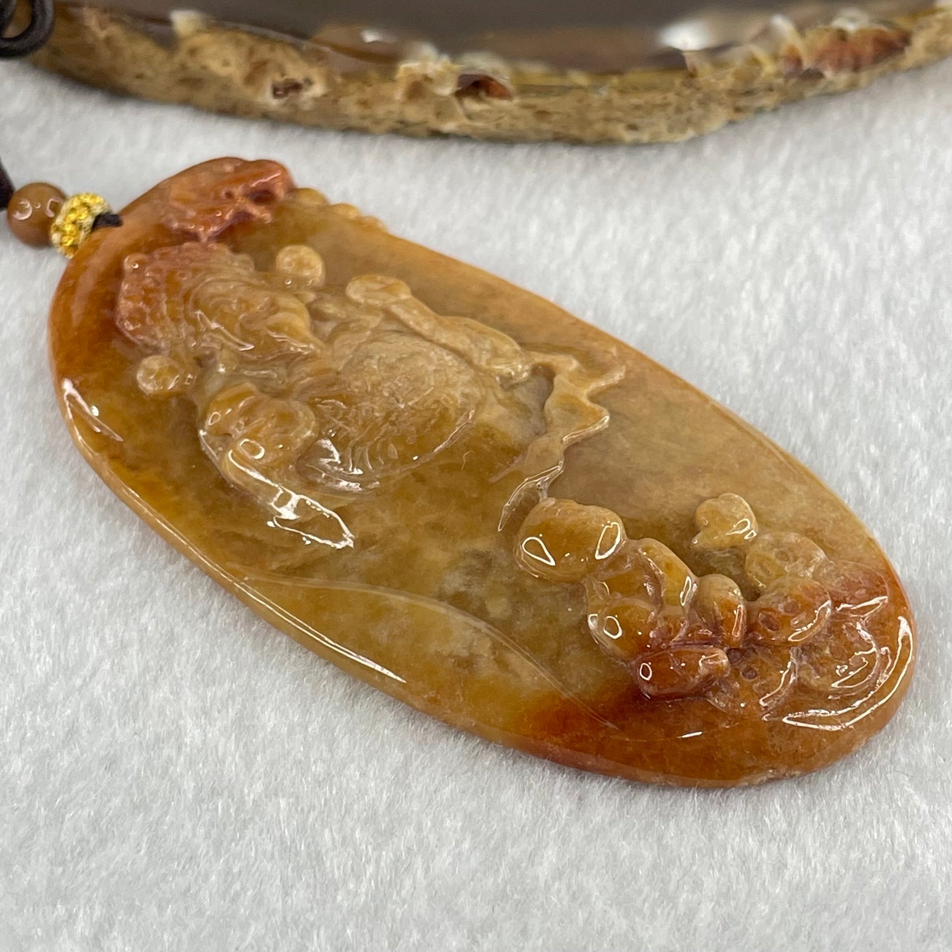 Grandmaster Type A Brown with Reddish  Patches Jadeite Cai Shen with Tong Zi Ingot and Dragon  Pendant 吉星高照 48.68g 76 by 39.7 by 6.3mm - Huangs Jadeite and Jewelry Pte Ltd
