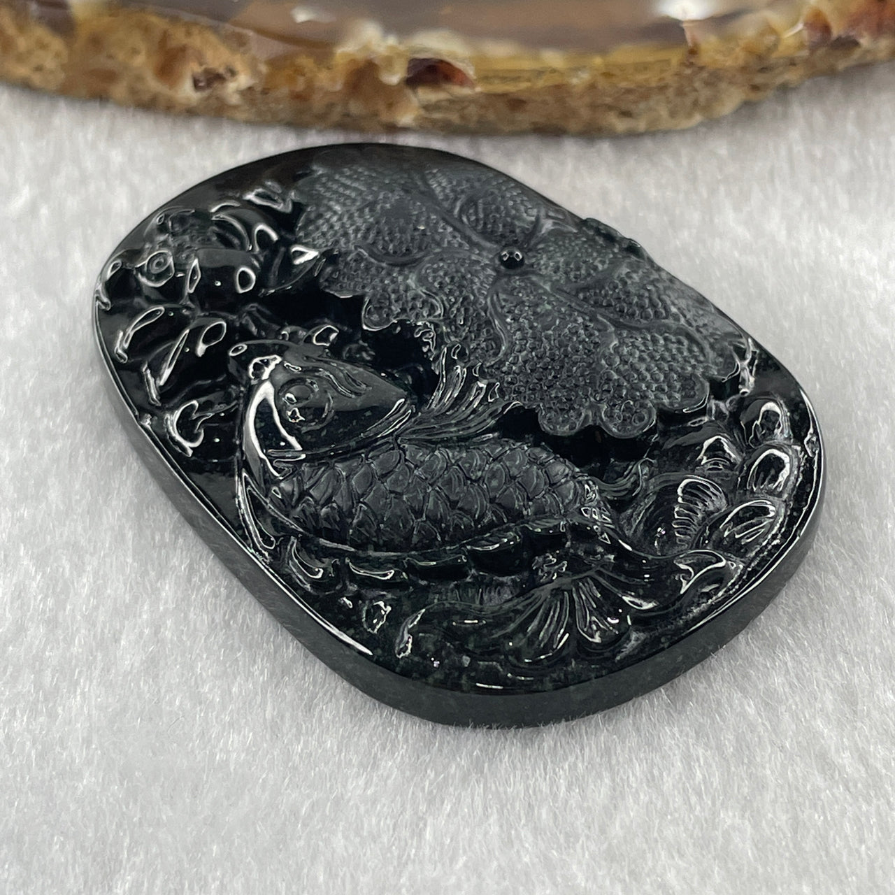 Type A Opaque to Partial Translucent Black Omphacite Jadeite Fish with Lotus Flower and Leaf Pendant 24.60g 51.1 by 35.9 by 8.8mm - Huangs Jadeite and Jewelry Pte Ltd
