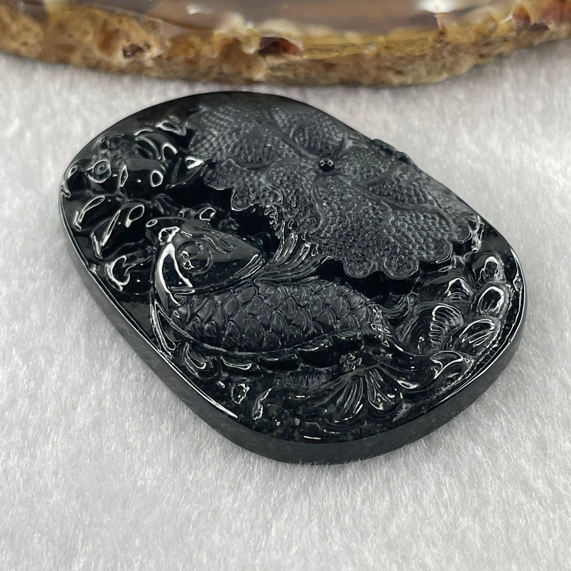 Type A Opaque to Partial Translucent Black Omphacite Jadeite Fish with Lotus Flower and Leaf Pendant 24.60g 51.1 by 35.9 by 8.8mm - Huangs Jadeite and Jewelry Pte Ltd