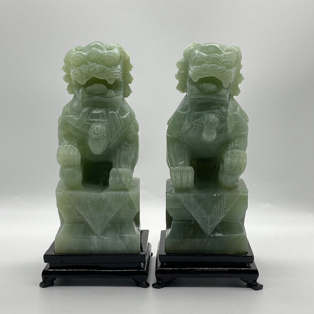 Natural Green Serpentine Pair of Fu Gou with Wooden Stand Display 2,753.4g 131.0 by 105.0 by 235.0mm and 2,790.0g 125.5 by 106.0 by 230.0mm