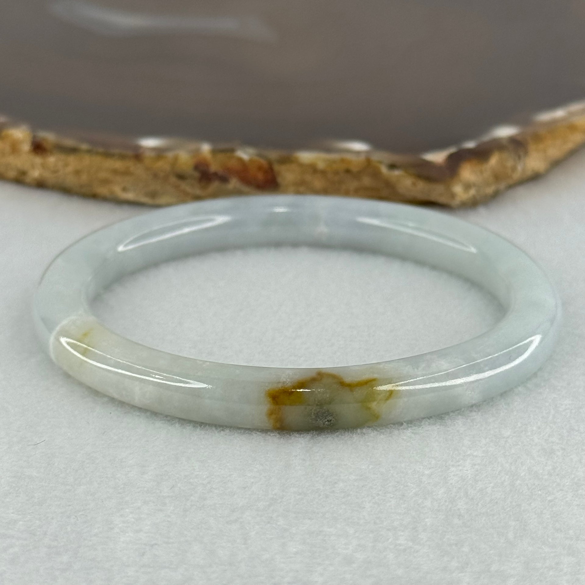 Type A Sky Blue with Green and Brown Patch Jadeite Oval Bangle Internal Diameter 58.0mm 32.09g 7.4 by 7.9mm (External Rough with Internal Lines) - Huangs Jadeite and Jewelry Pte Ltd