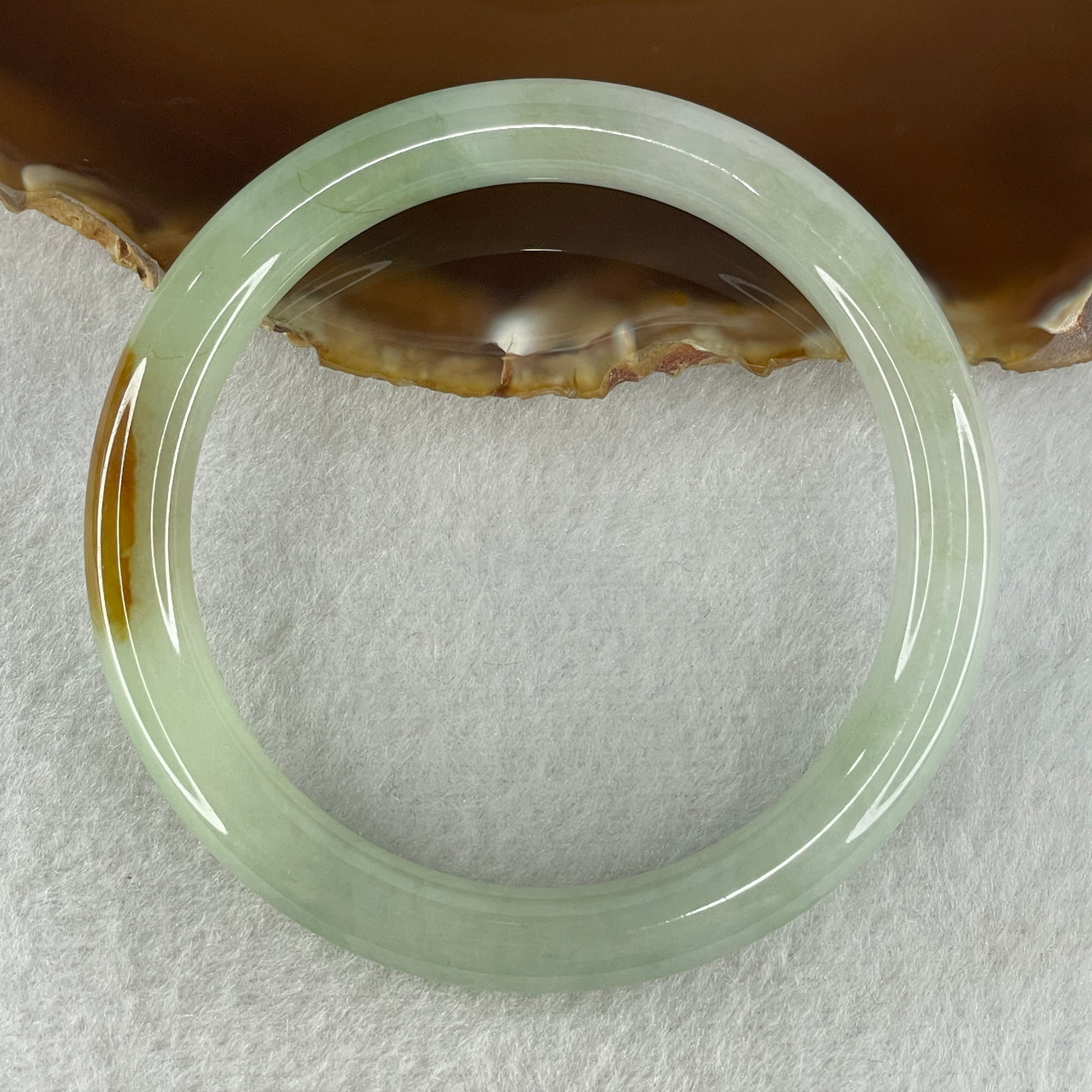 Natural Type A Light Green with Yellow Brown Patch Jadeite Bangle 38.72g Inner Diameter 56.5mm Thickness 8.7 by 8.6mm (Internal Lines)