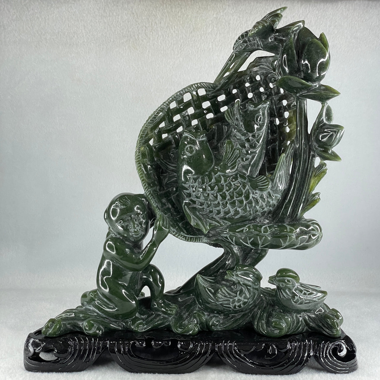 Natural Dark Green Serpentine Double Carp Fish with Gui ren and Lotus and Twin Ducks with Wooden Stand Display 2,032.7g 242.0 by 95.0 by 263.0mm - Huangs Jadeite and Jewelry Pte Ltd