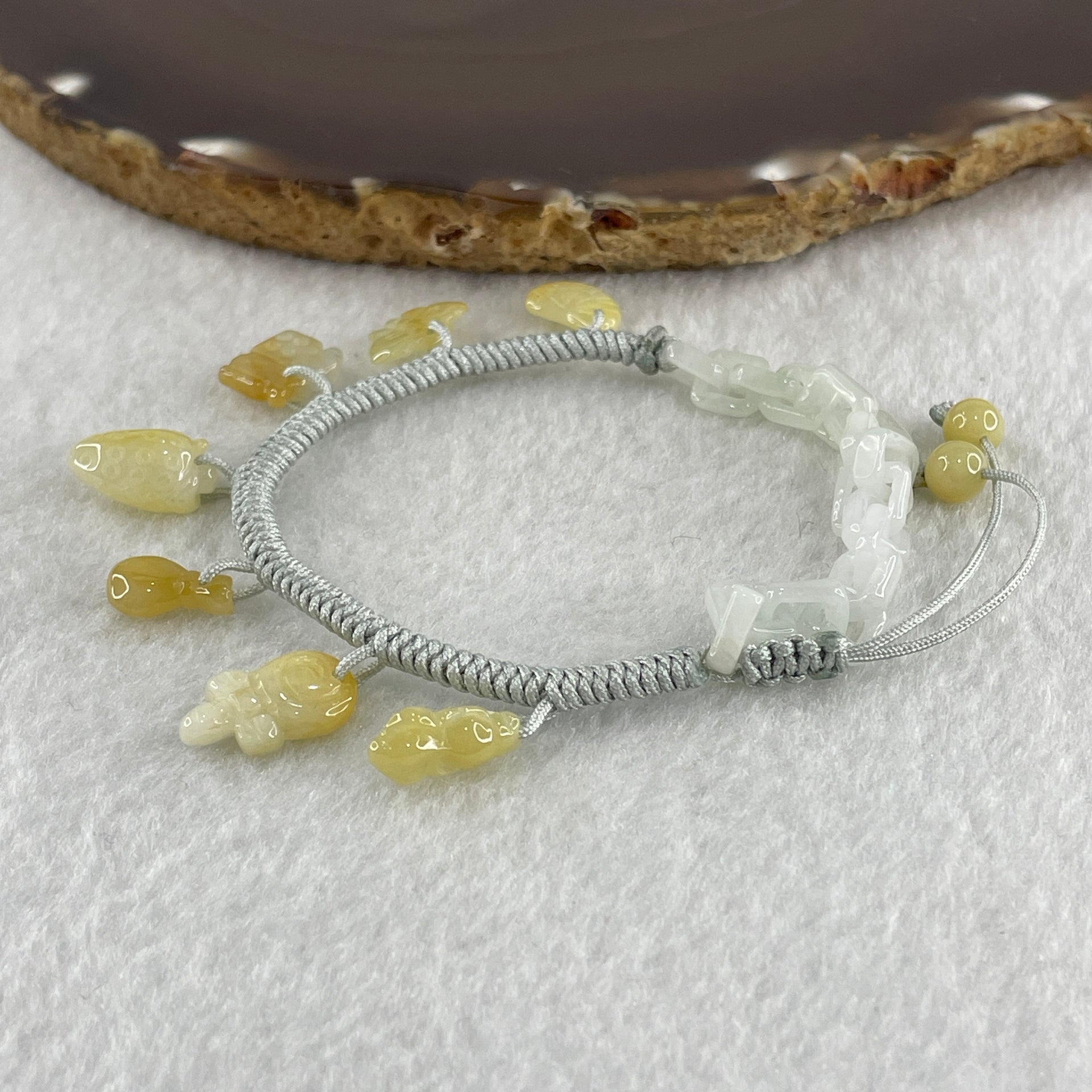 Natural Type A Yellowish Jadeite Money Bag Hulu Fu Butterfly in String Bracelet 8.79g 16-20cm 12.7 by 8.8 by 6.9mm - Huangs Jadeite and Jewelry Pte Ltd