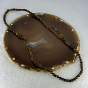 Natural Dark Brown Flower Amber Beads Elastic Necklace 8.02g 50cm 5.4mm 105 Beads - Huangs Jadeite and Jewelry Pte Ltd