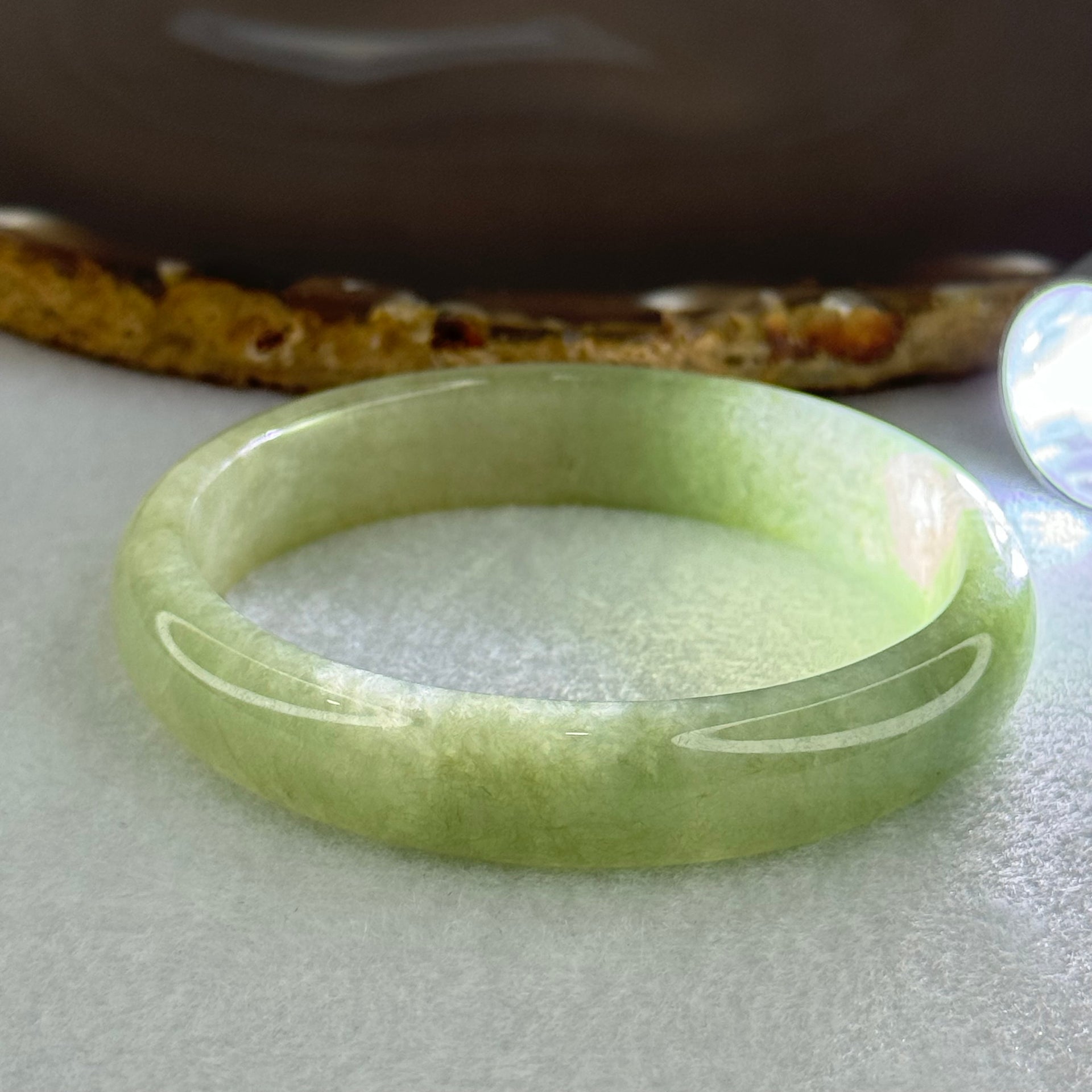 Type A Full Green Jadeite Oval Bangle Internal Diameter 55.4mm 11.9 by 6.5mm (Very Slight Fine Internal Lines) - Huangs Jadeite and Jewelry Pte Ltd