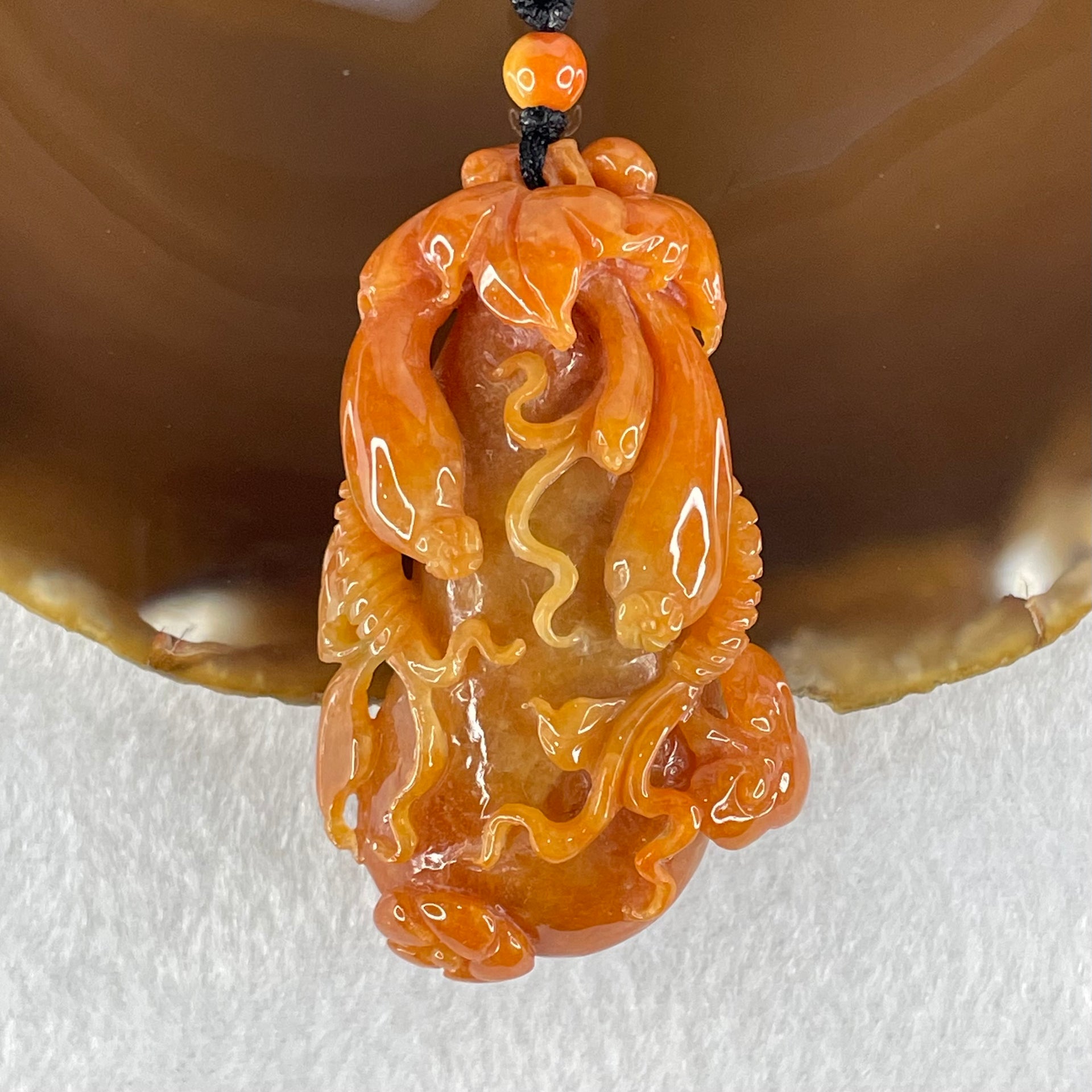 Grandmaster Type A Brownish Orange to Brownish Red Jadeite Melon and Ruyi 福瓜 Pendant 45.95g 58.05 by 34.38 by 15.00mm With NGI Cert 82838787 - Huangs Jadeite and Jewelry Pte Ltd