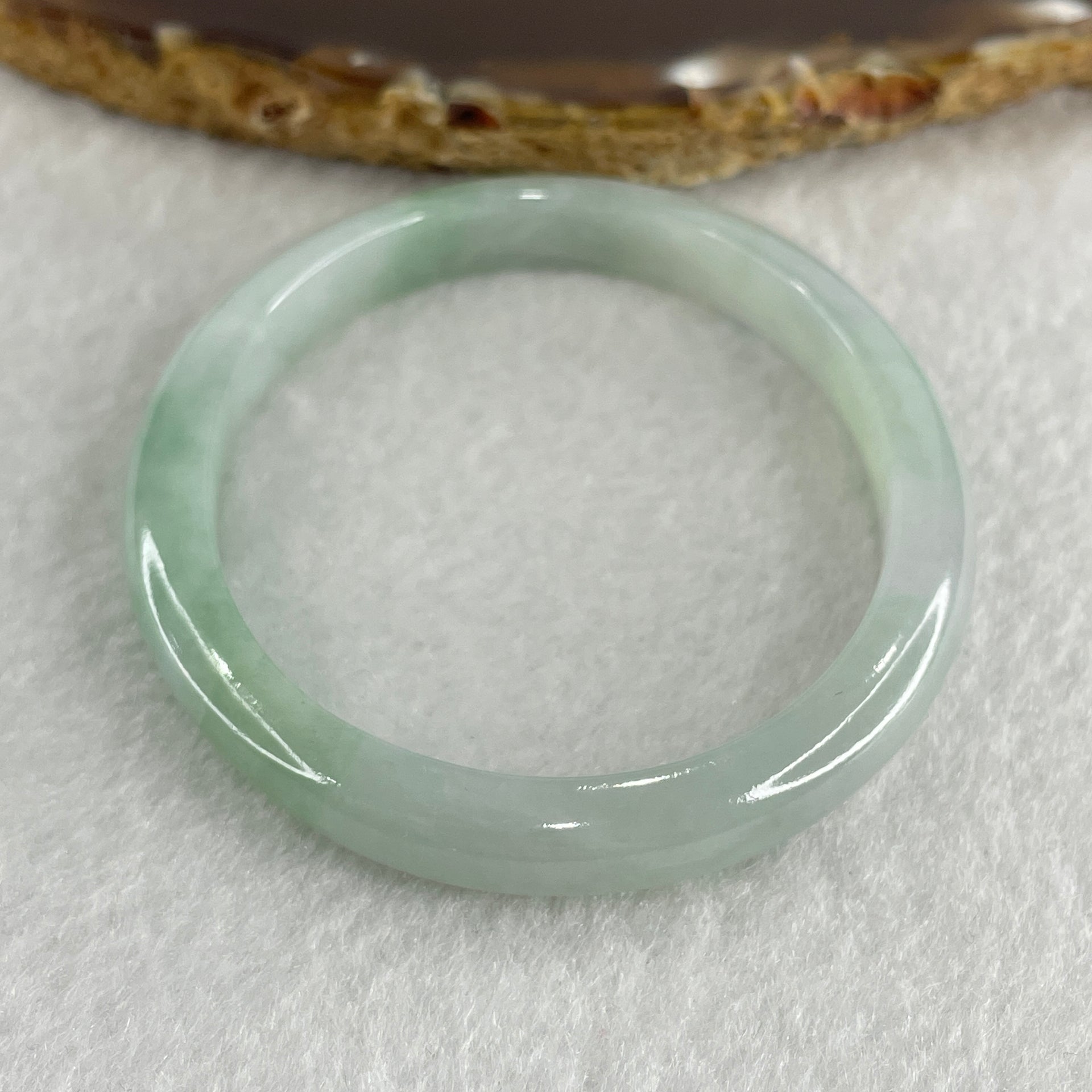 Certified Type A Light Green with Green Patches Jadeite Oval Bangle Internal Diameter 54.3mm 20.69g 7.5 by 6.4mm ( Very Slight Internal Lines ) - Huangs Jadeite and Jewelry Pte Ltd