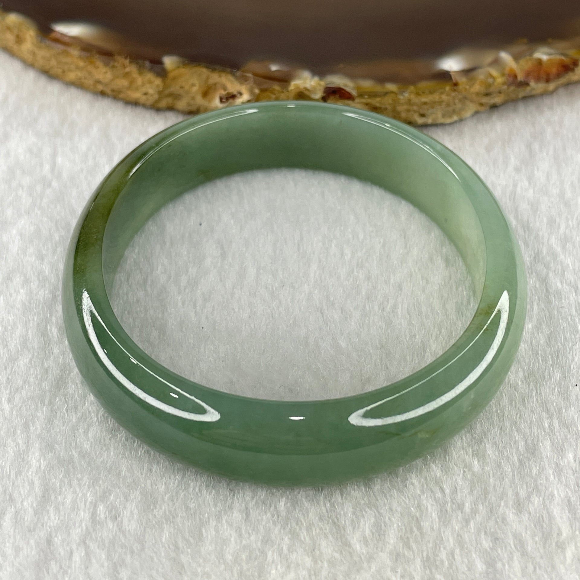 Natural Type A Jelly Full Green Jadeite Oval Bangle 31.63g Inner Diameter 54.9mm 11.6 by 5.6mm (Slight Internal Lines) - Huangs Jadeite and Jewelry Pte Ltd