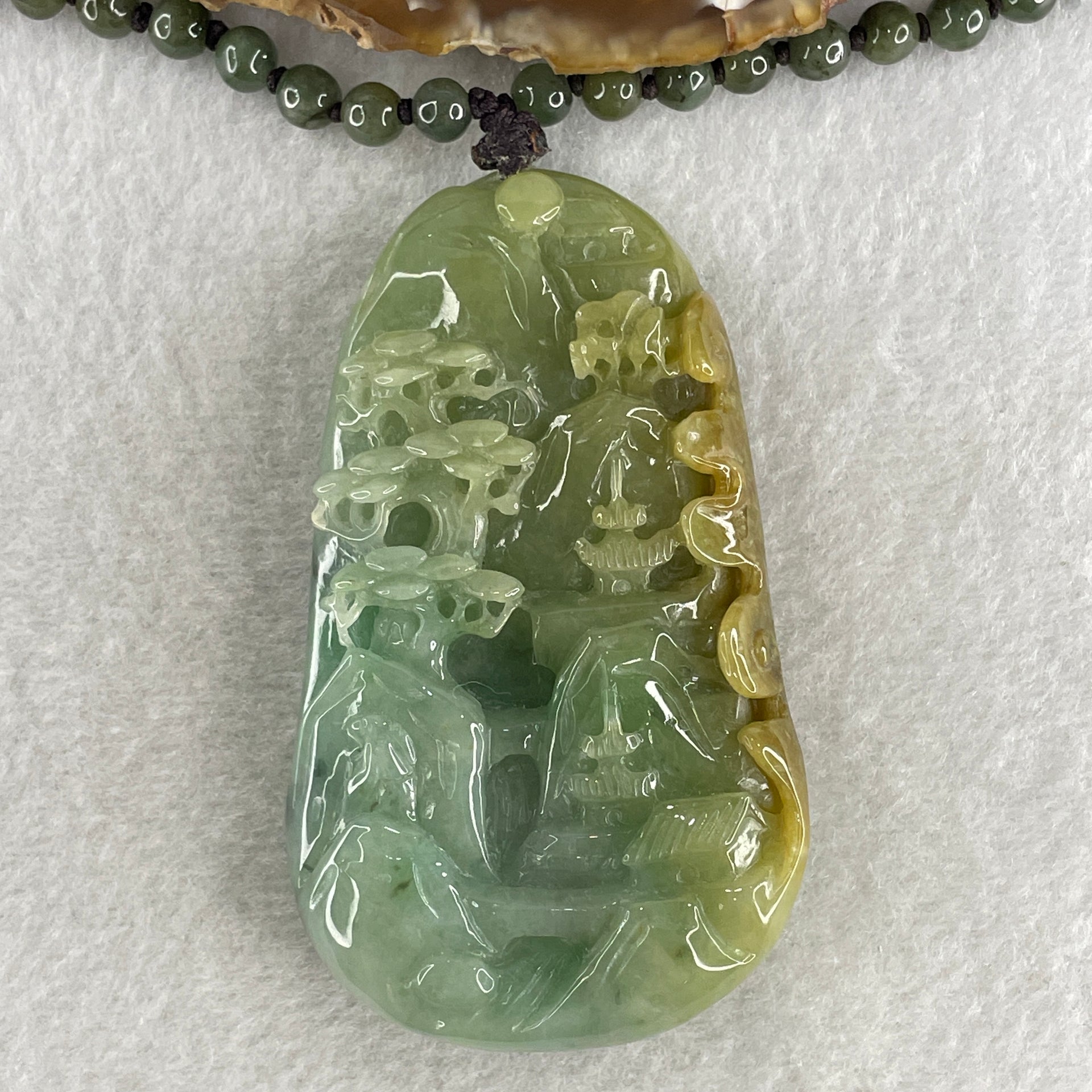 Natural Type A Green with Yellowish Jadeite Shan Shui with Gui Ren Pendant 127.68g 75.0 by 44.7 by 14.7mm - Huangs Jadeite and Jewelry Pte Ltd