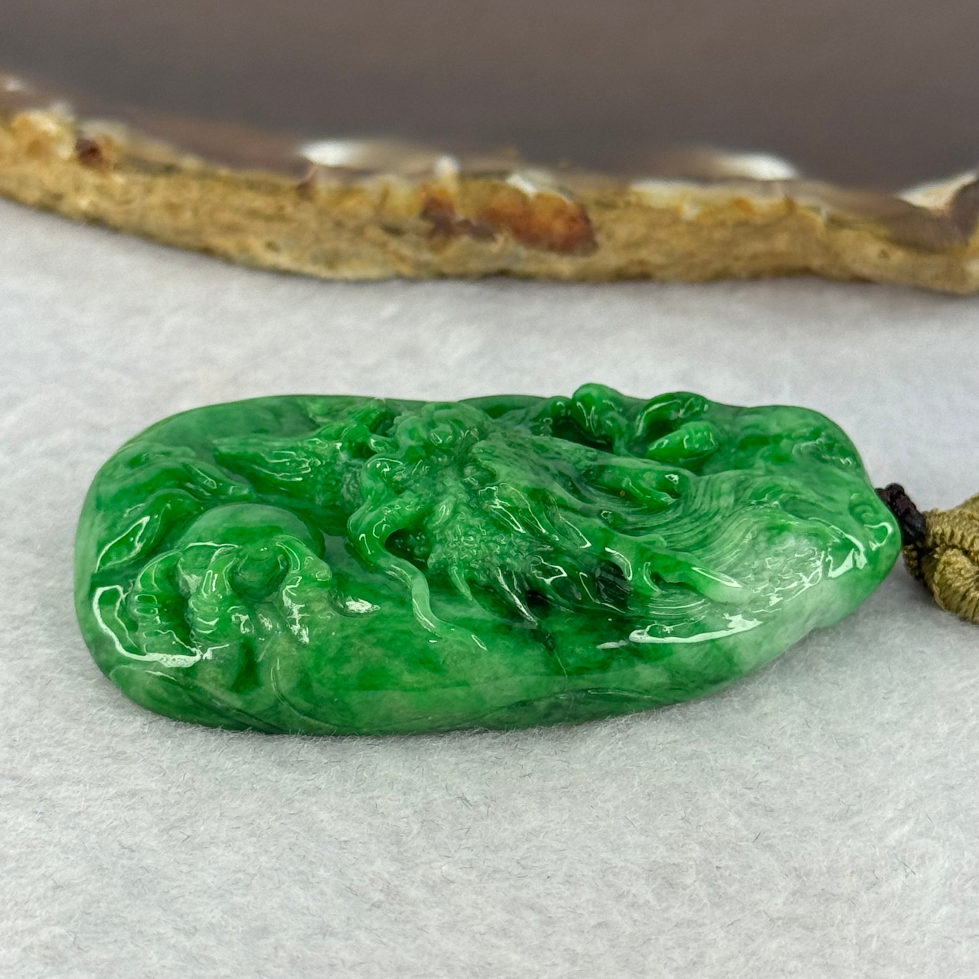Grand Master Type A Spicy Green Jadeite Dragon 38.59g 54.6 by 31.6 by 11.3mm - Huangs Jadeite and Jewelry Pte Ltd